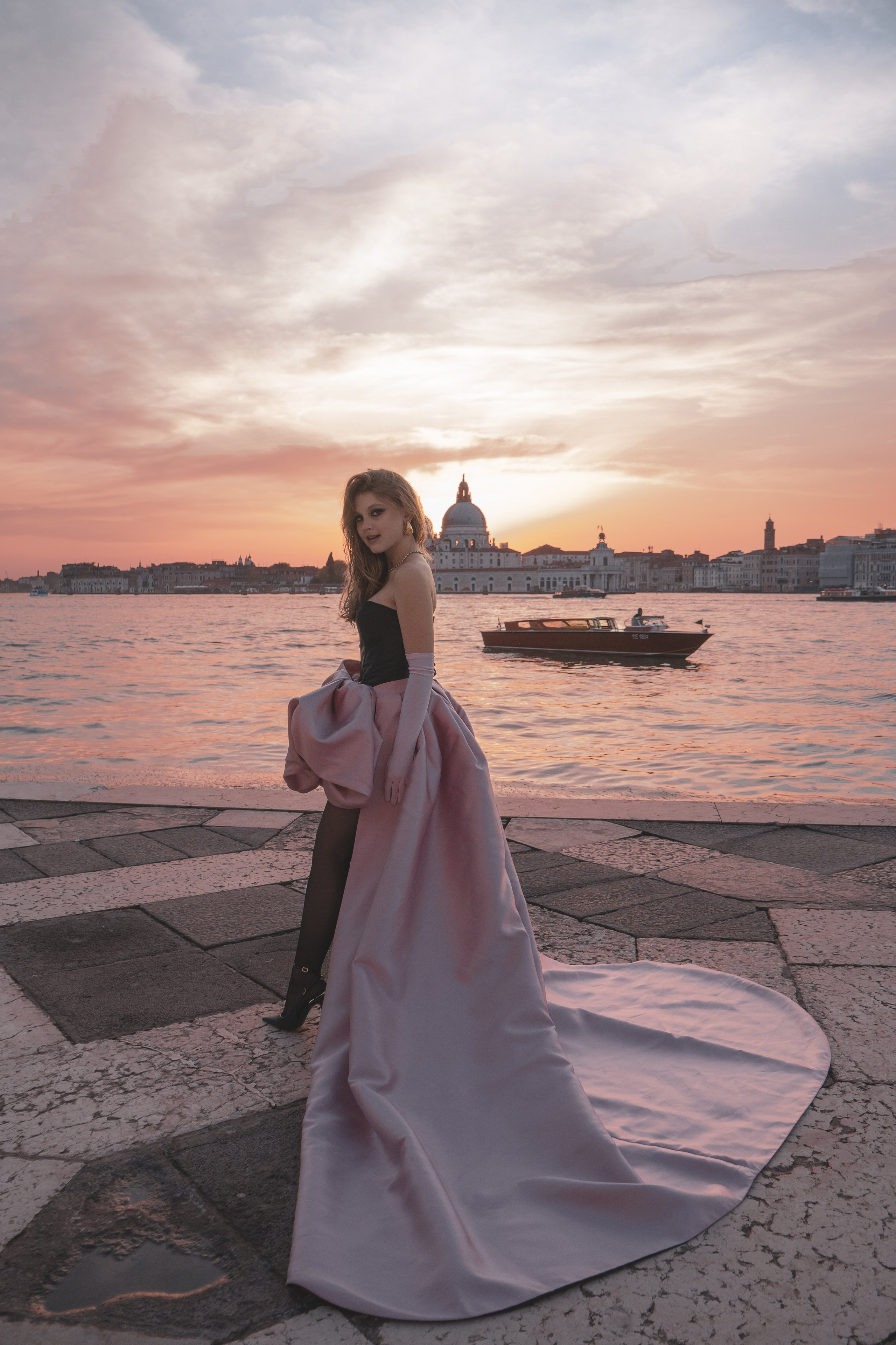  High-fashion photoshoot Venice with golden hour light near Piazza San Marco.