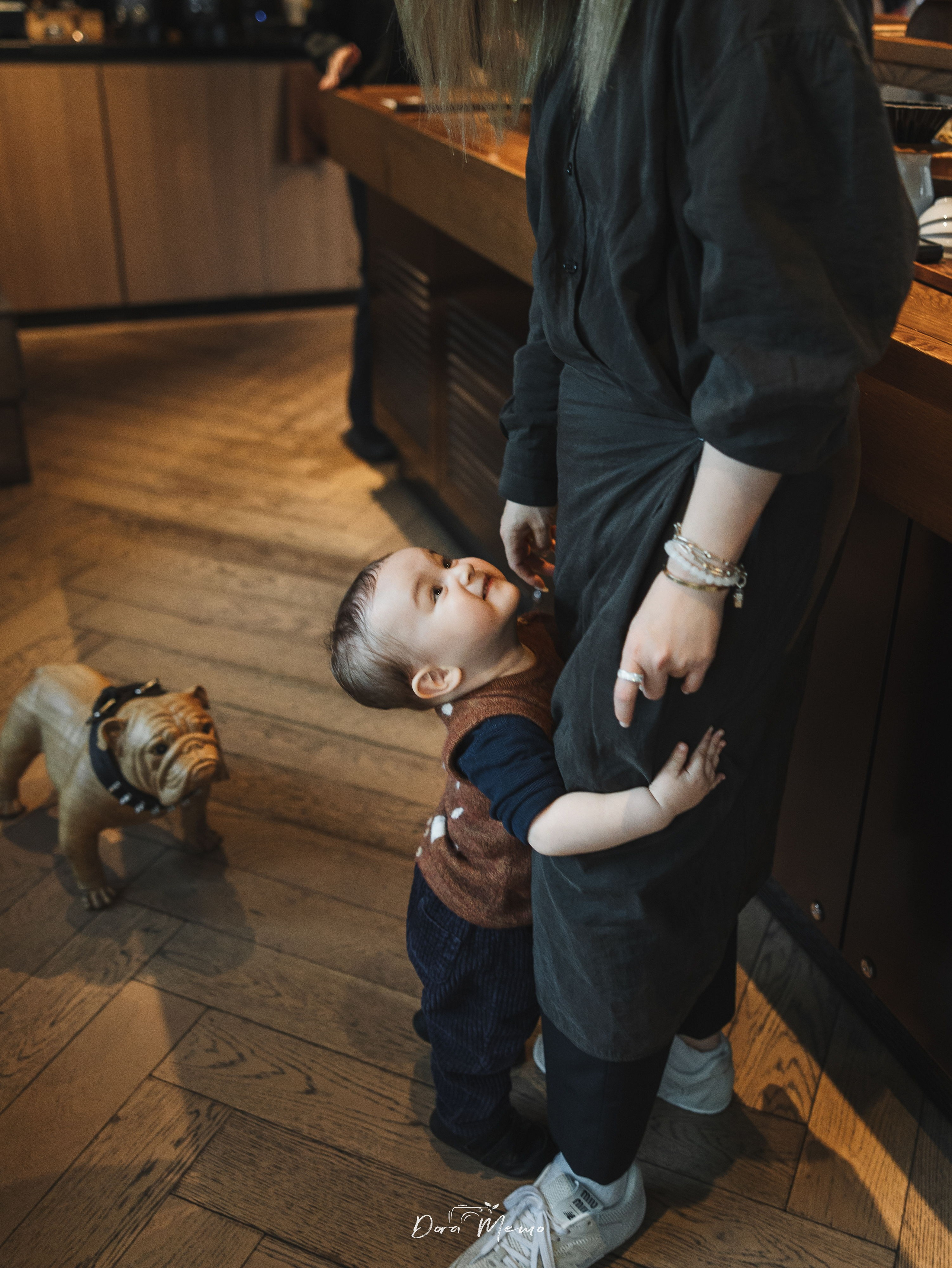 The one-year-old baby playing with his mom.