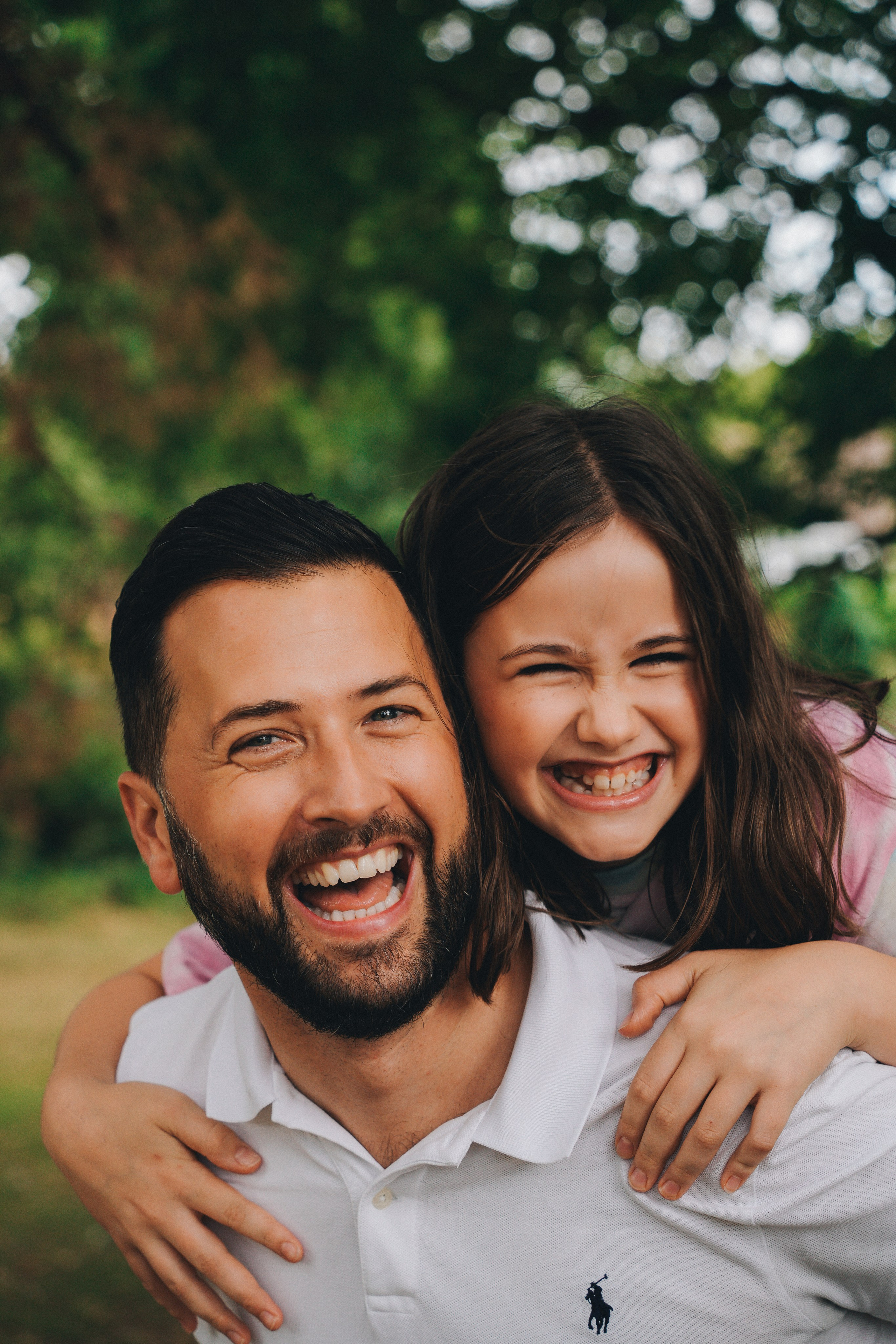 Family photo shoot in Solihull and Birmingham, Daughter is hugging dad