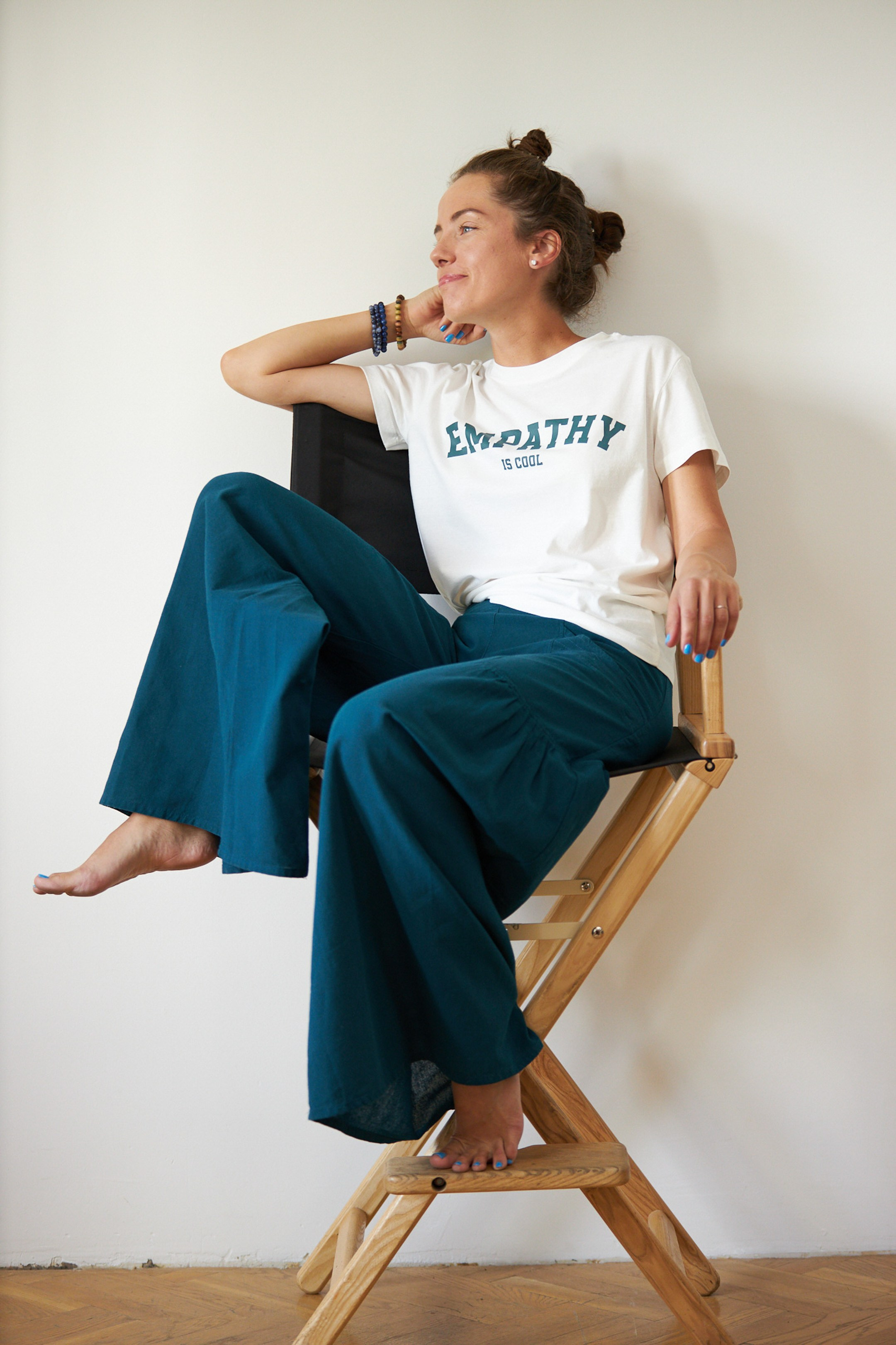 Emotional portrait of a young lady on a white studio background - - photographer Andrey Dunin