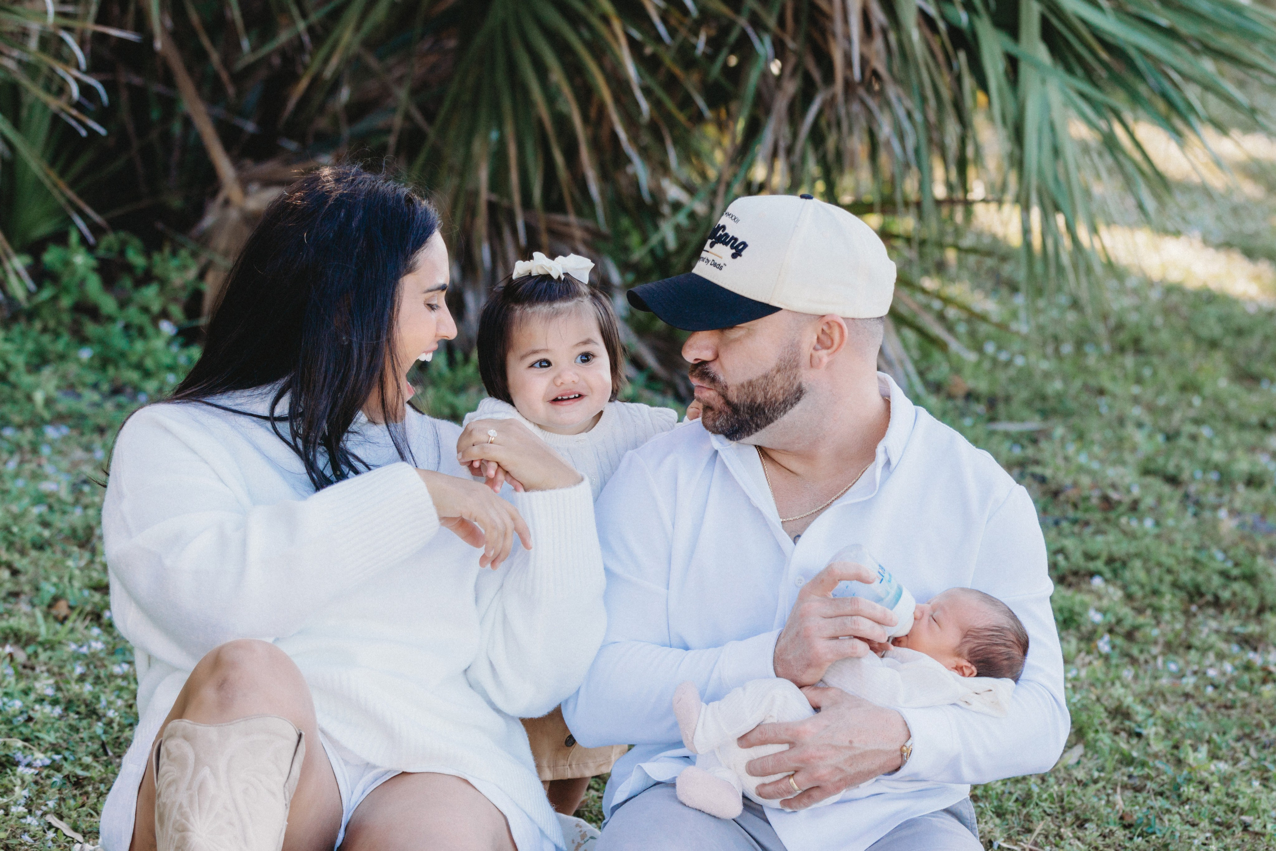  portrait of family with two kids on the blanket