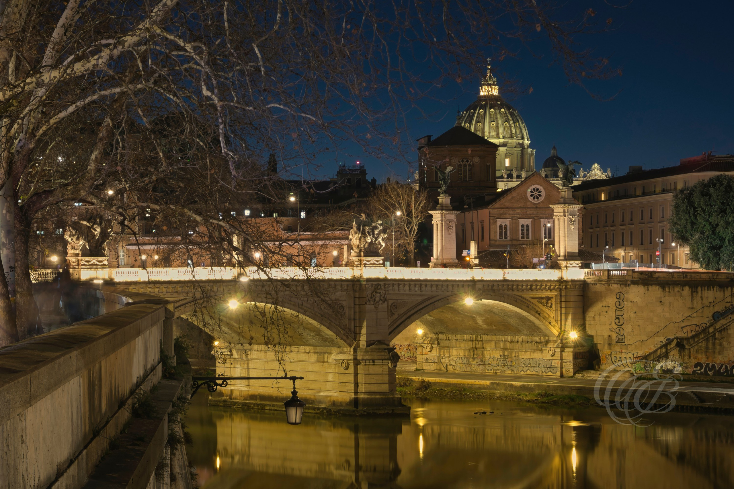 Rome, Italy—Ponte Vittorio Emanuele II crosses the Tiber River between the historic center and the Vatican district. Named after Victor Emmanuel II, the first king of unified Italy, the bridge is distinguished by its monumental design and sculptural decoration, reflecting the national ambitions of Italy in the early twentieth century. Eduardo Bartoli Photography.