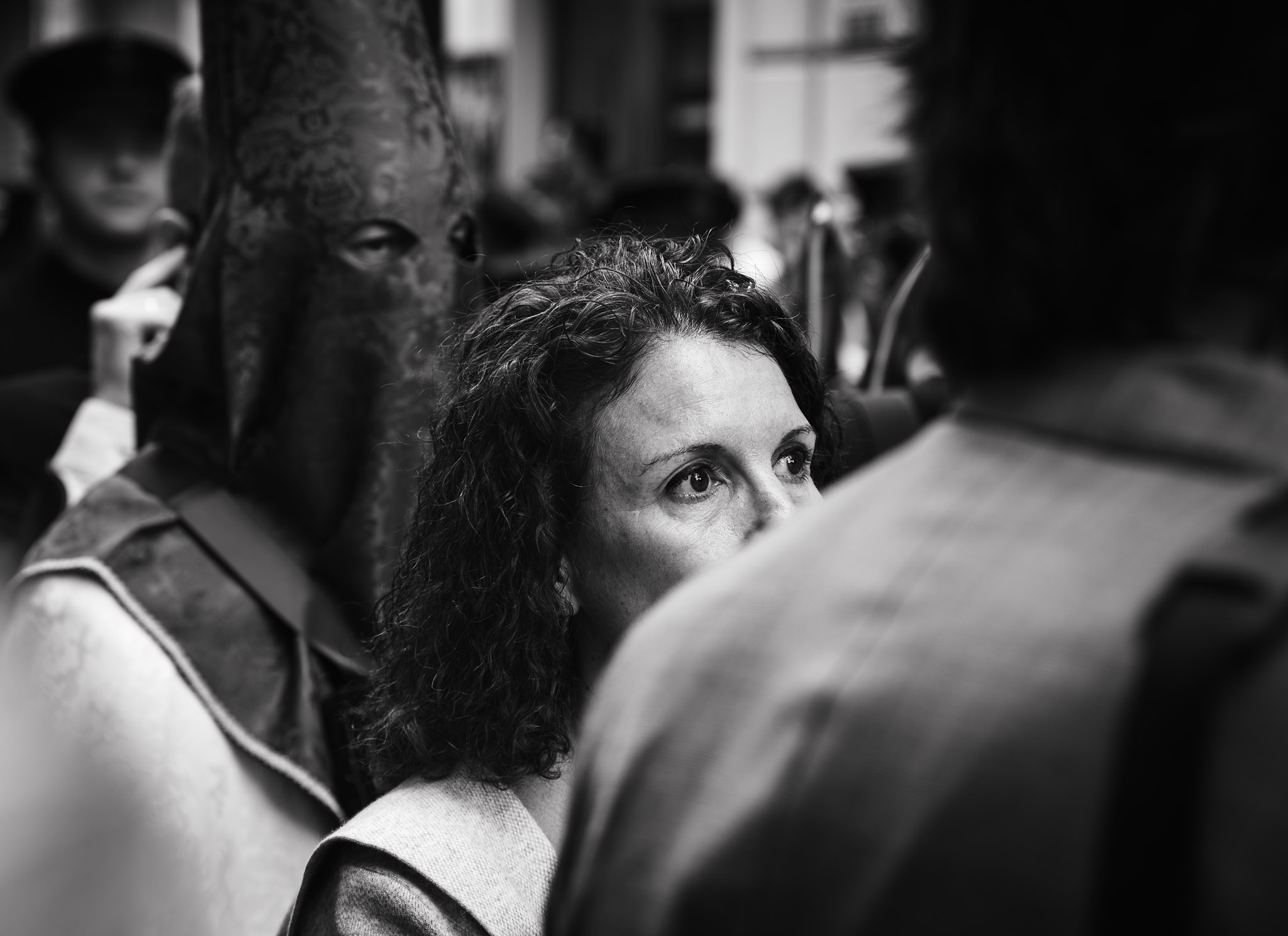 Woman watching Semana Santa procession in southern Spain
