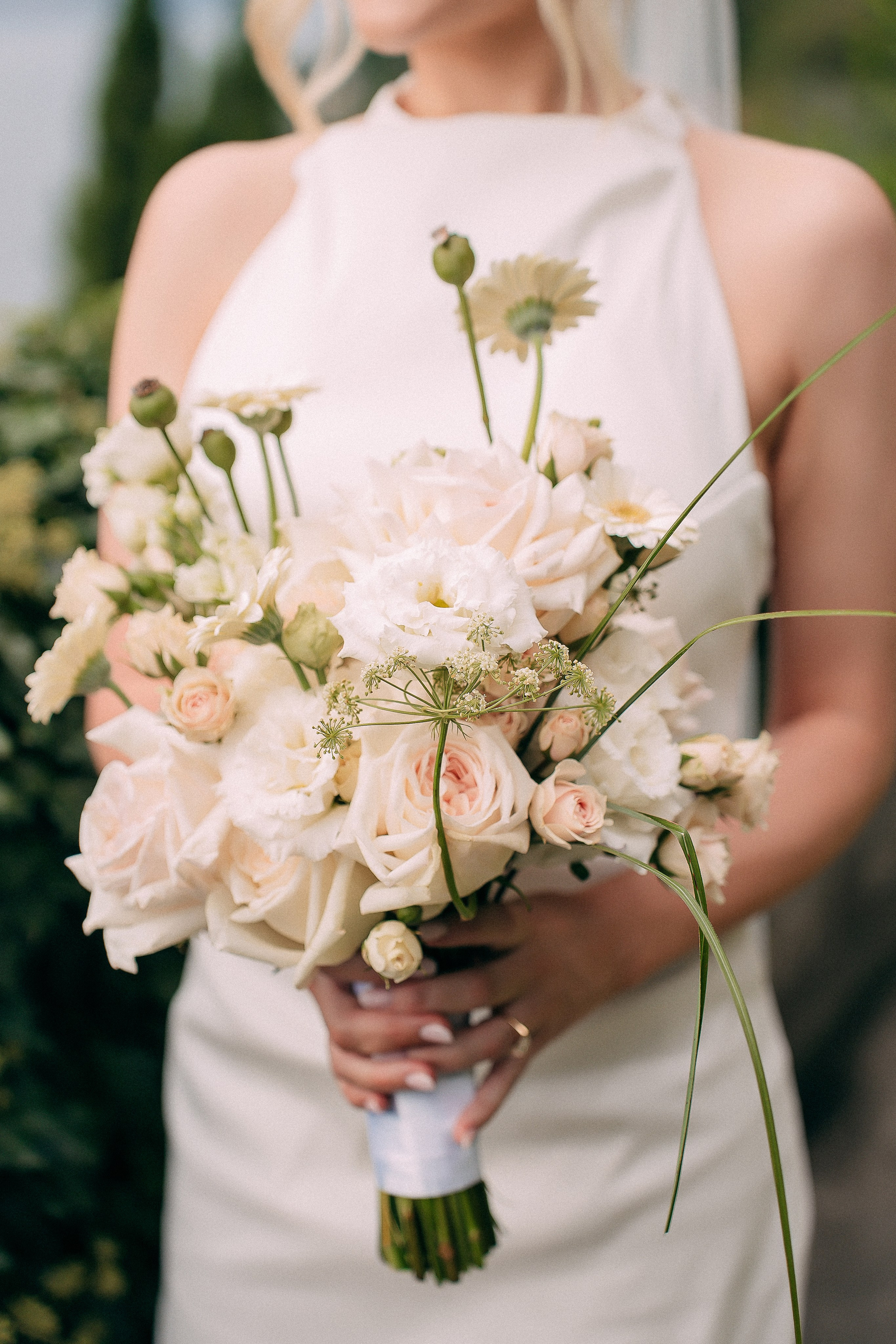 Close-up portrait of the bride with her bouquet at Villa Lario, Lake Como, Italy