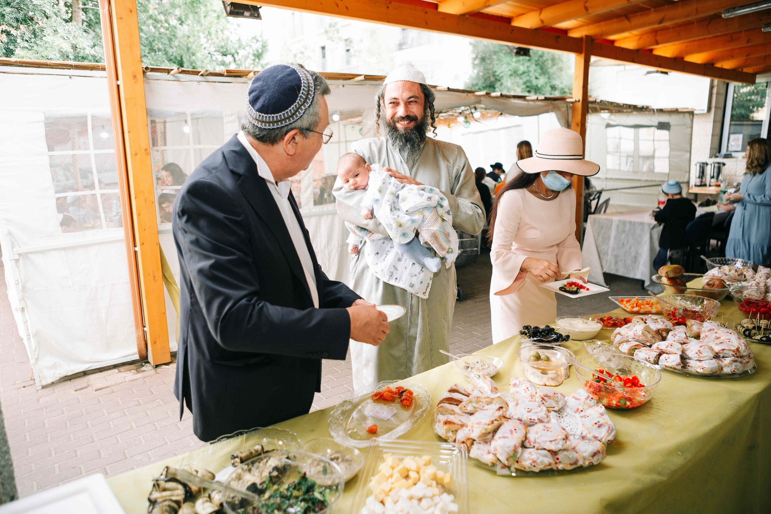 BRITH MILA IN THE SMALL SYNAGOGUE. PHOTOGRAPHER IN ISRAEL