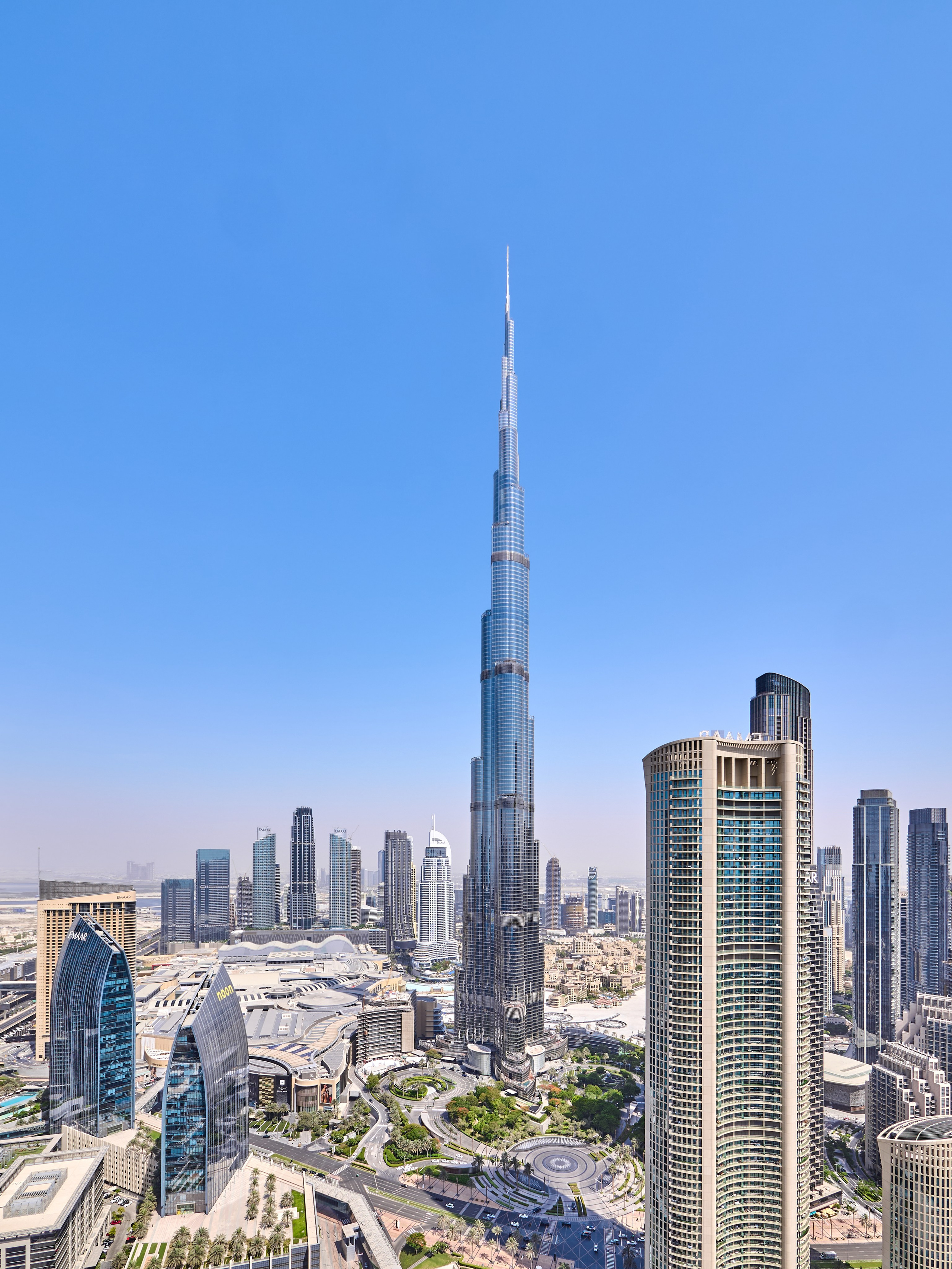 Stunning cityscape with Burj Khalifa skyline, perfect for real estate marketing and travel listings. Drone-style image by Dubai property photographer Oleg Novikov.