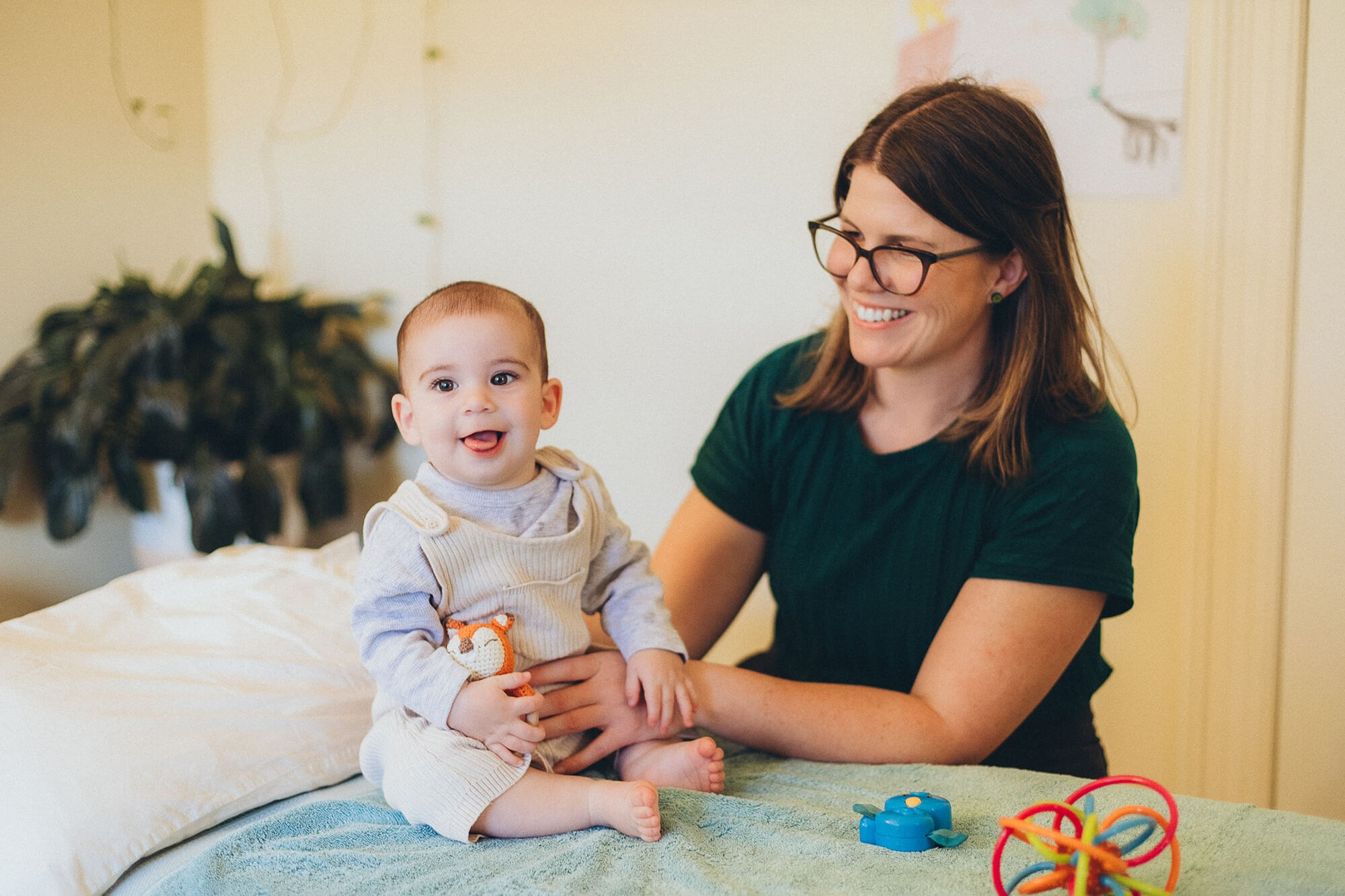 Practitioner setting up treatment room – business photography Melbourne