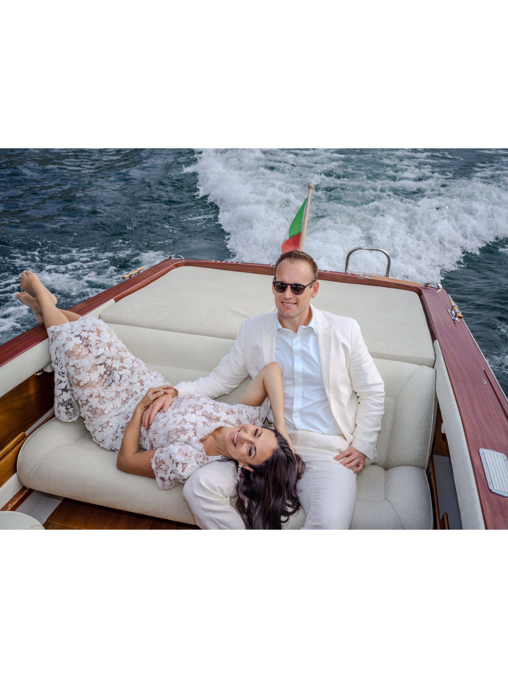 Elopement couple on yacht cruising Lake Como