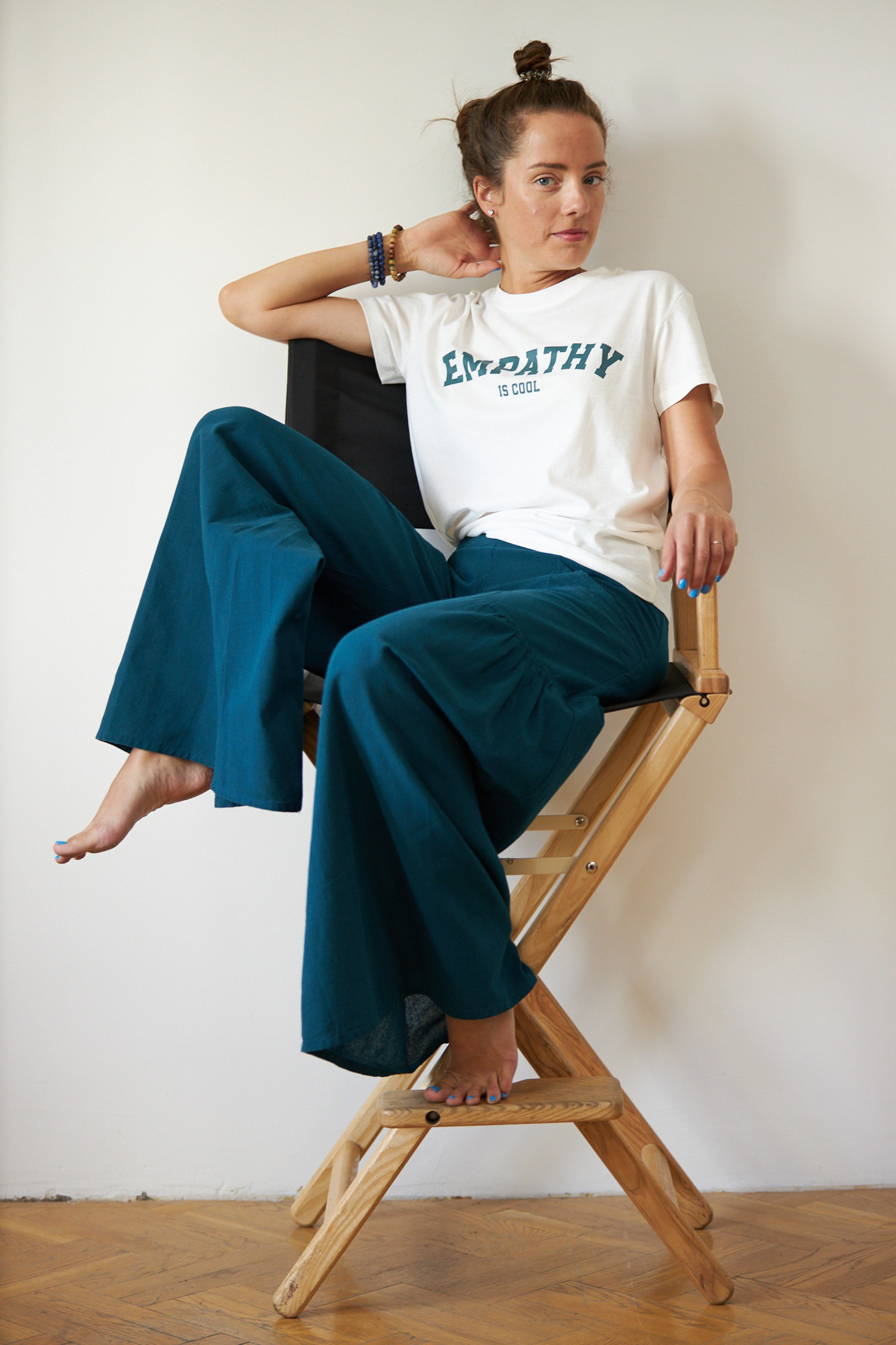 Emotional portrait of a young lady on a white studio background - - photographer Andrey Dunin
