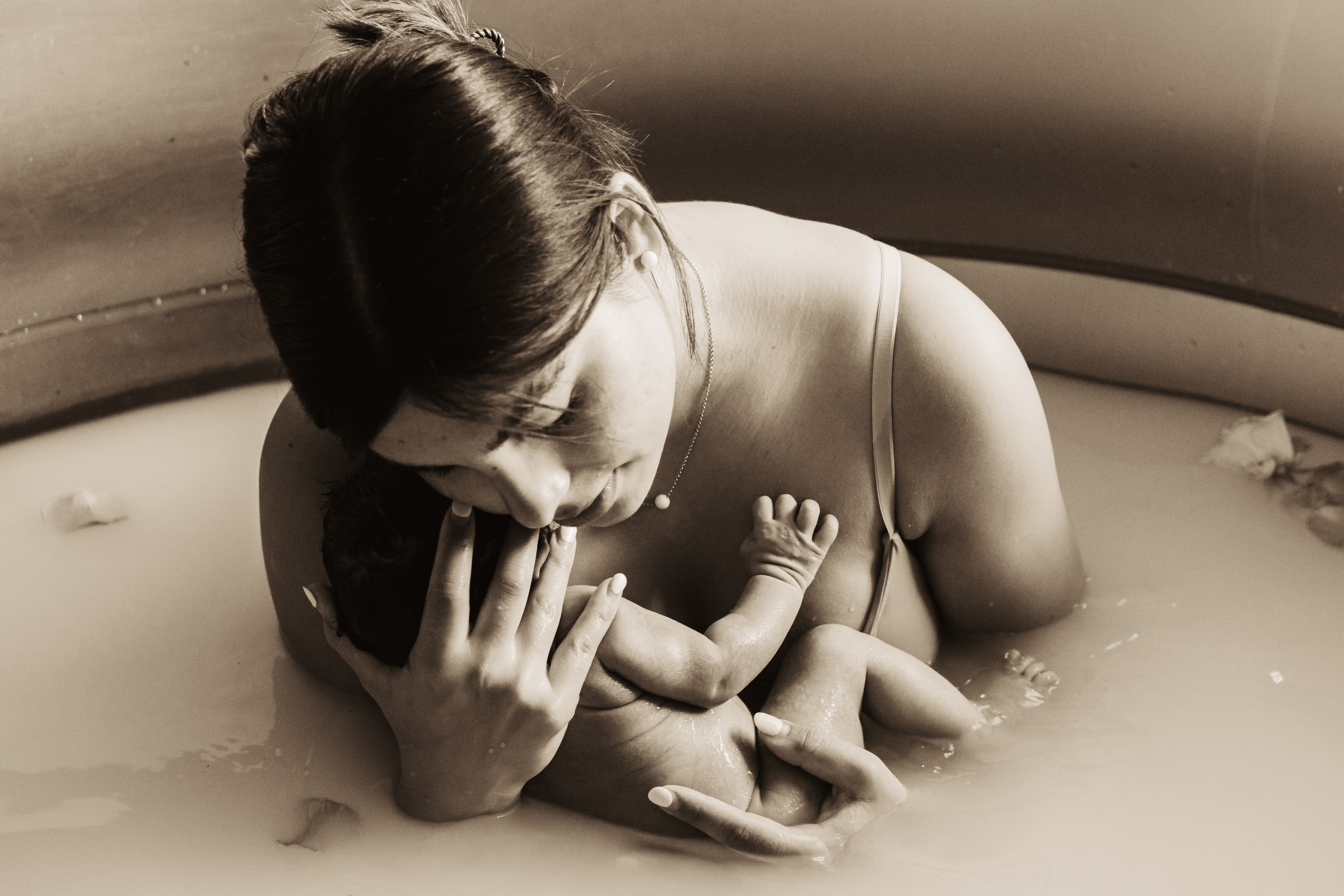 Monika, Pool newborn shooting. Family photographer Aargau Zurich
