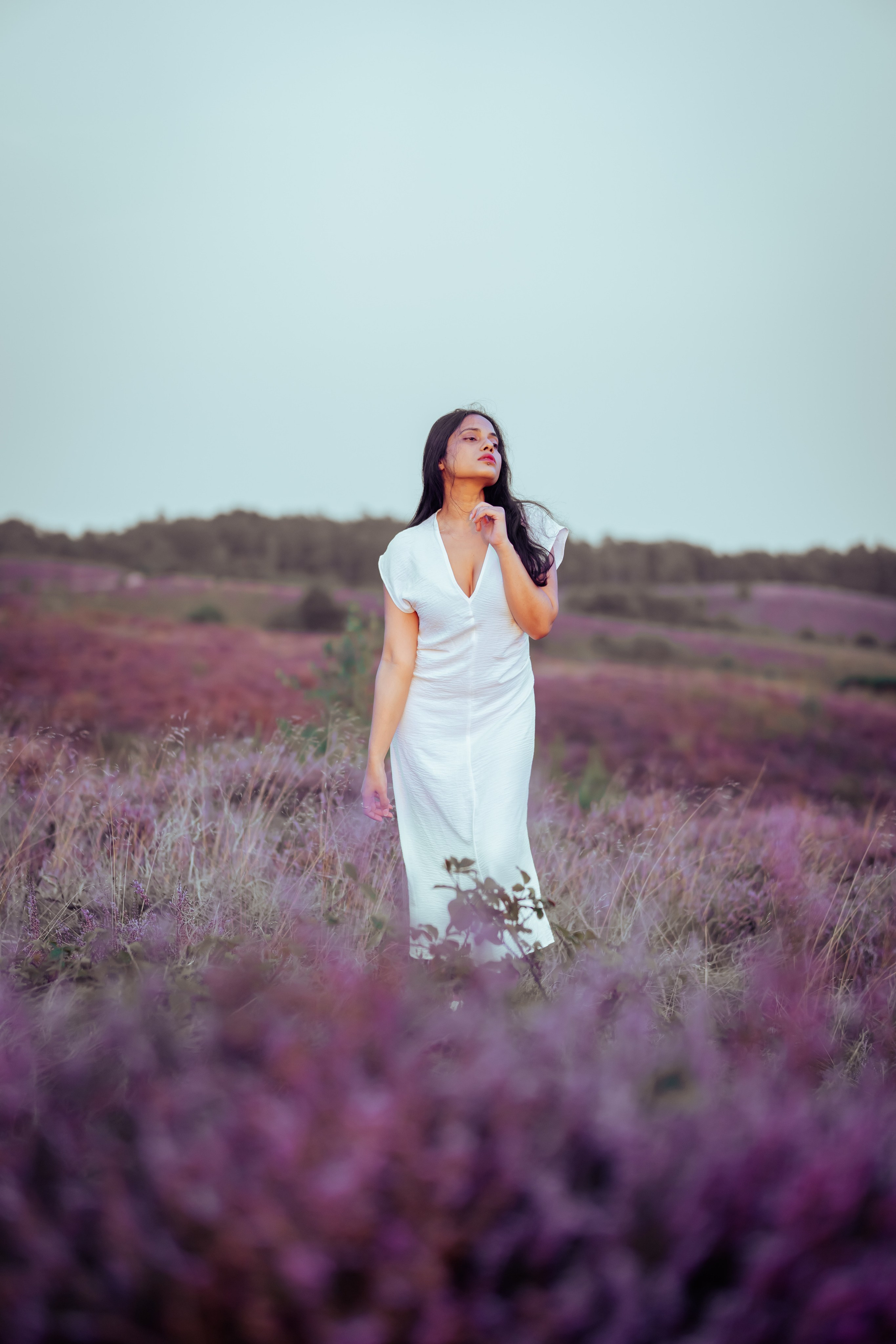 woman standing in veluwe heather fields netherlands