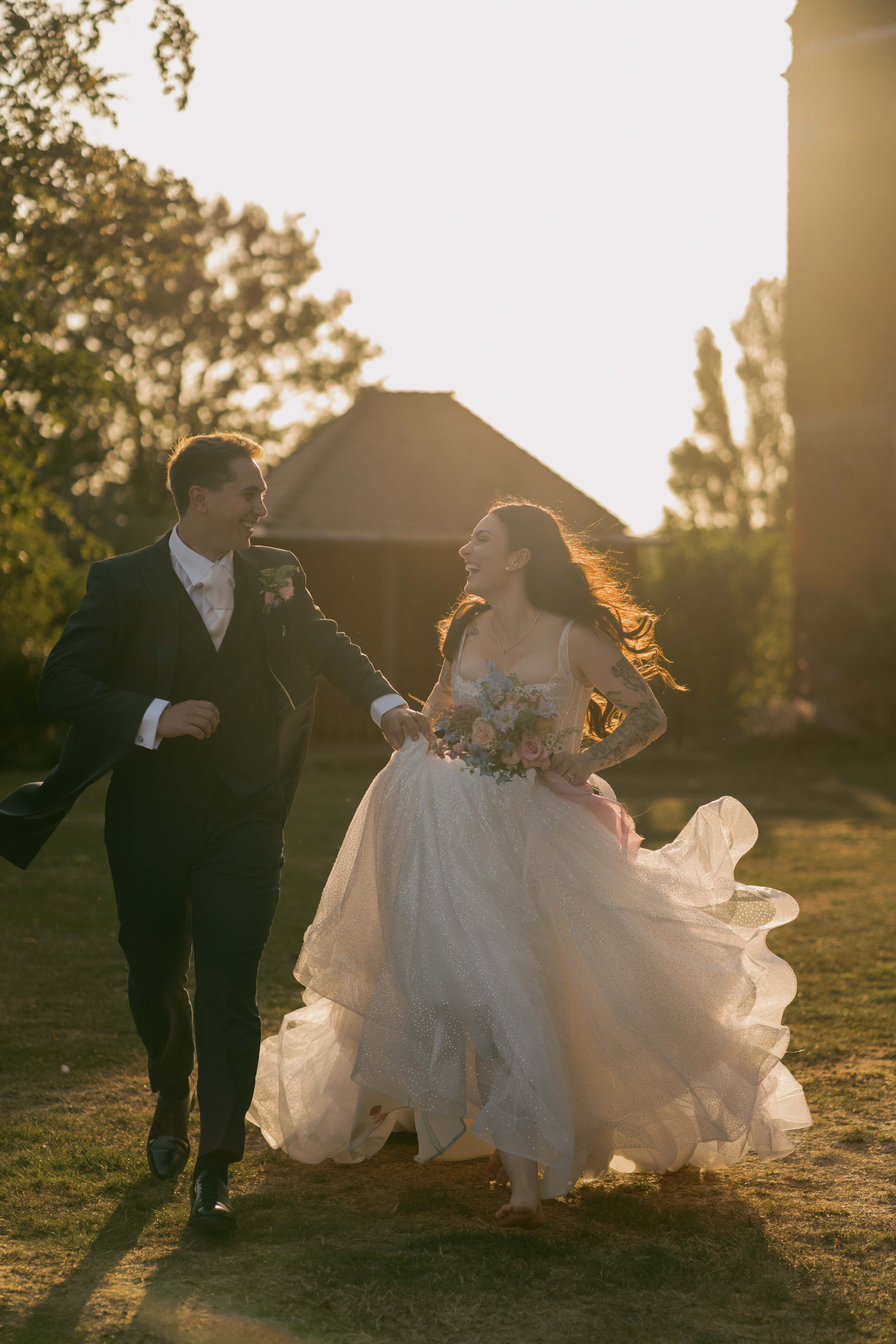     bride and groom at sunset Layer Marney Tower cinematic wedding photography
