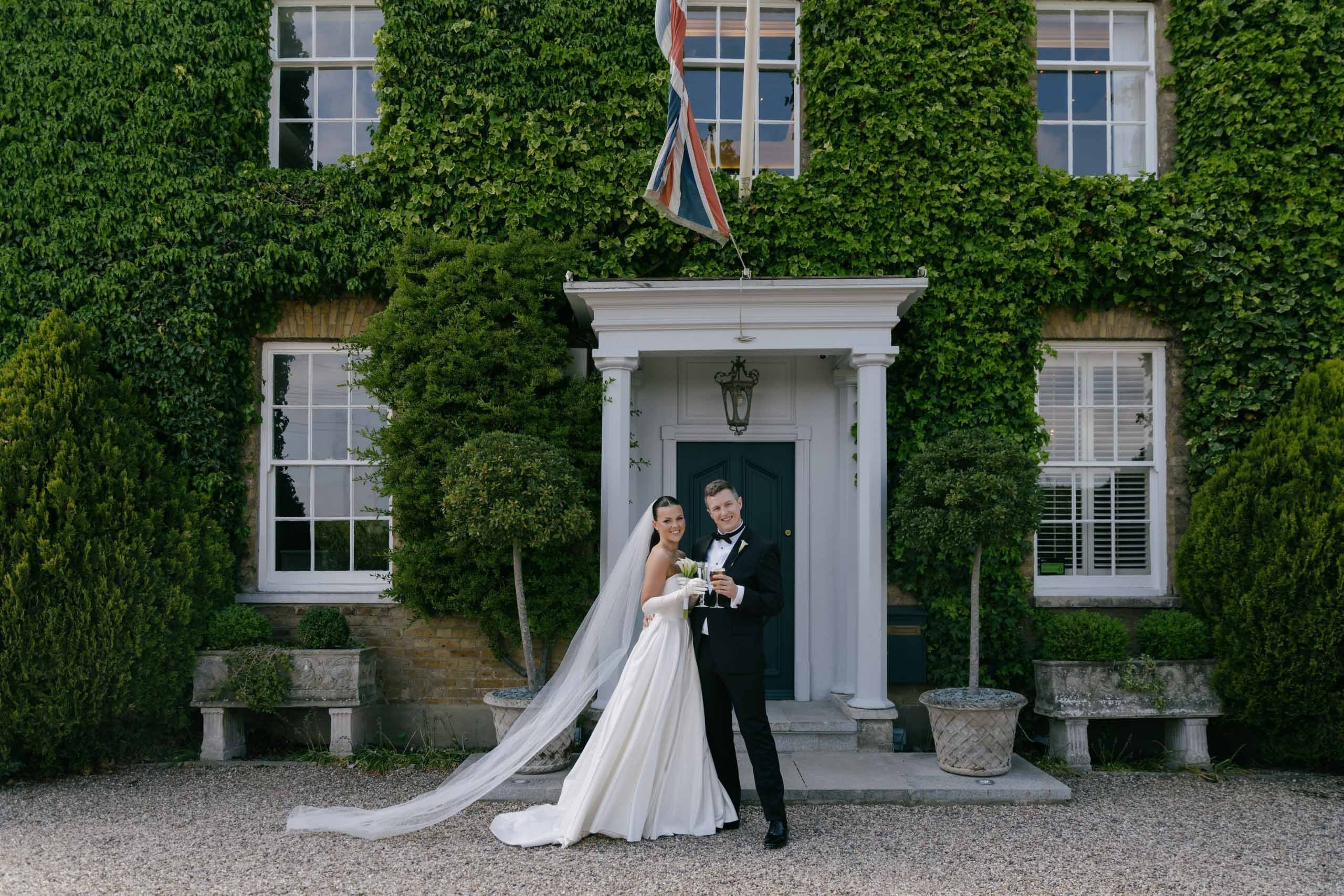 Bride and groom elegant portrait with champagne relaxed wedding moment