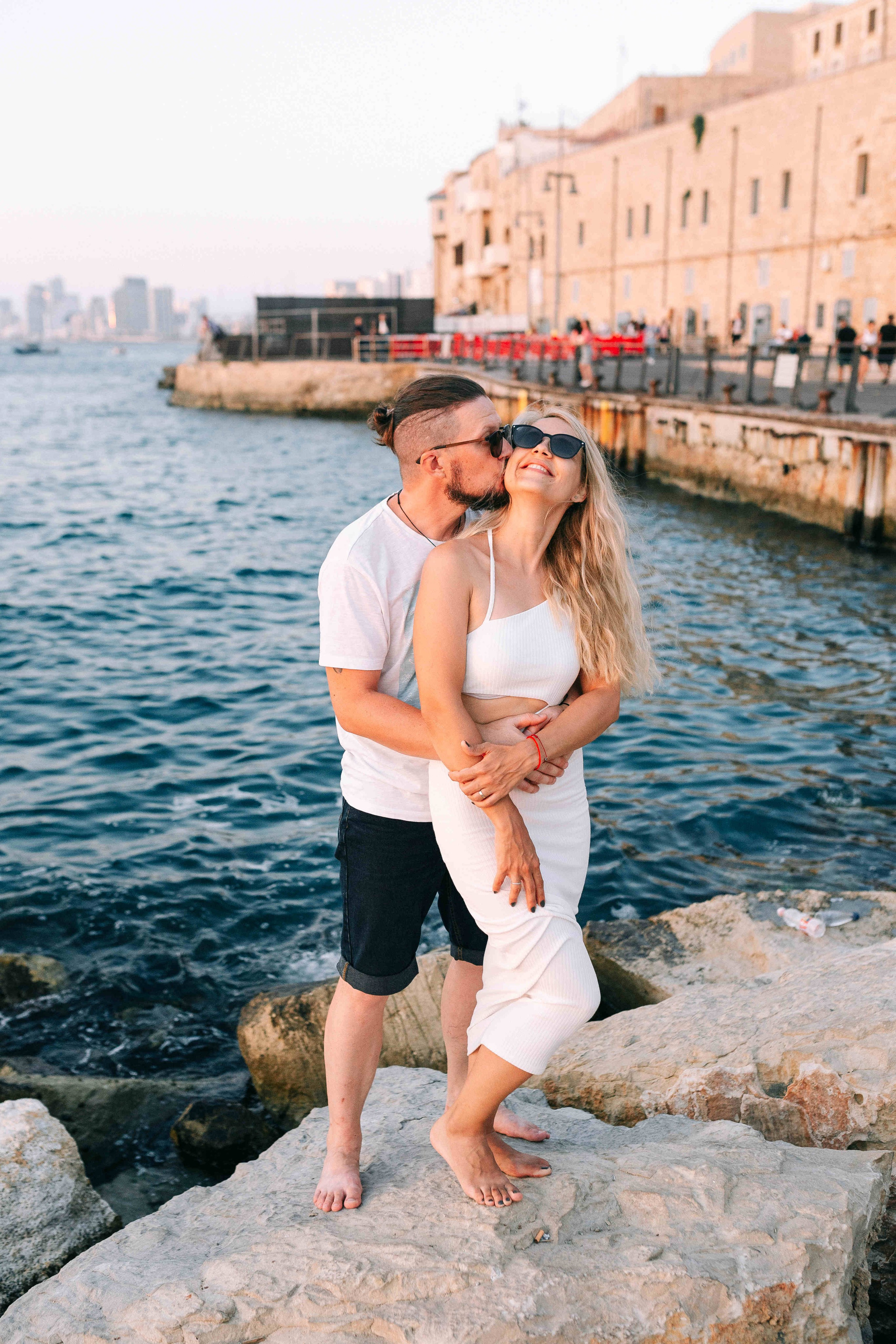 SUNSET IN JAFFO PORT. PHOTOGRAPHER IN ISRAEL