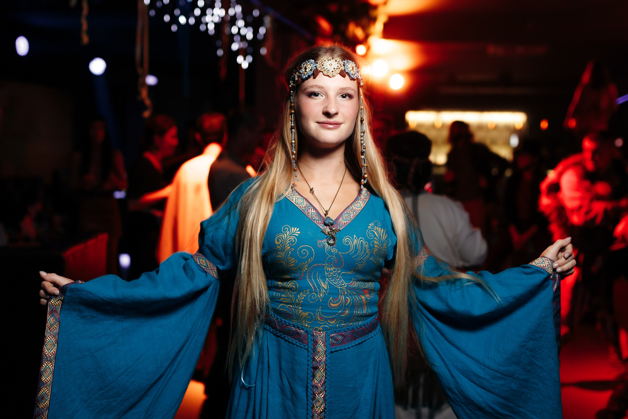 Woman dancing with friends at party, joyful moment