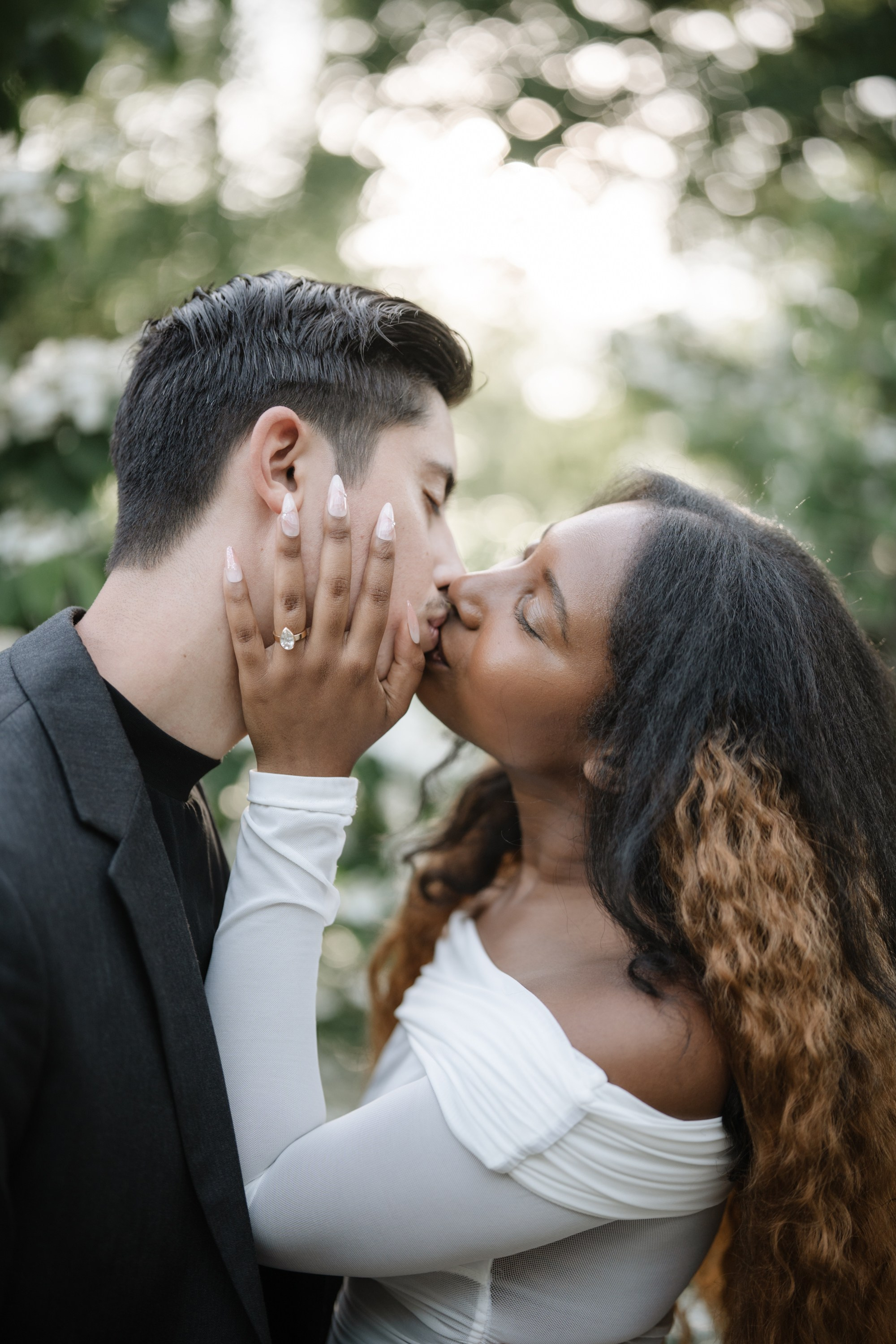 Engagement photo shoot in Central Park in spring. Portrait and wedding photographer in New York