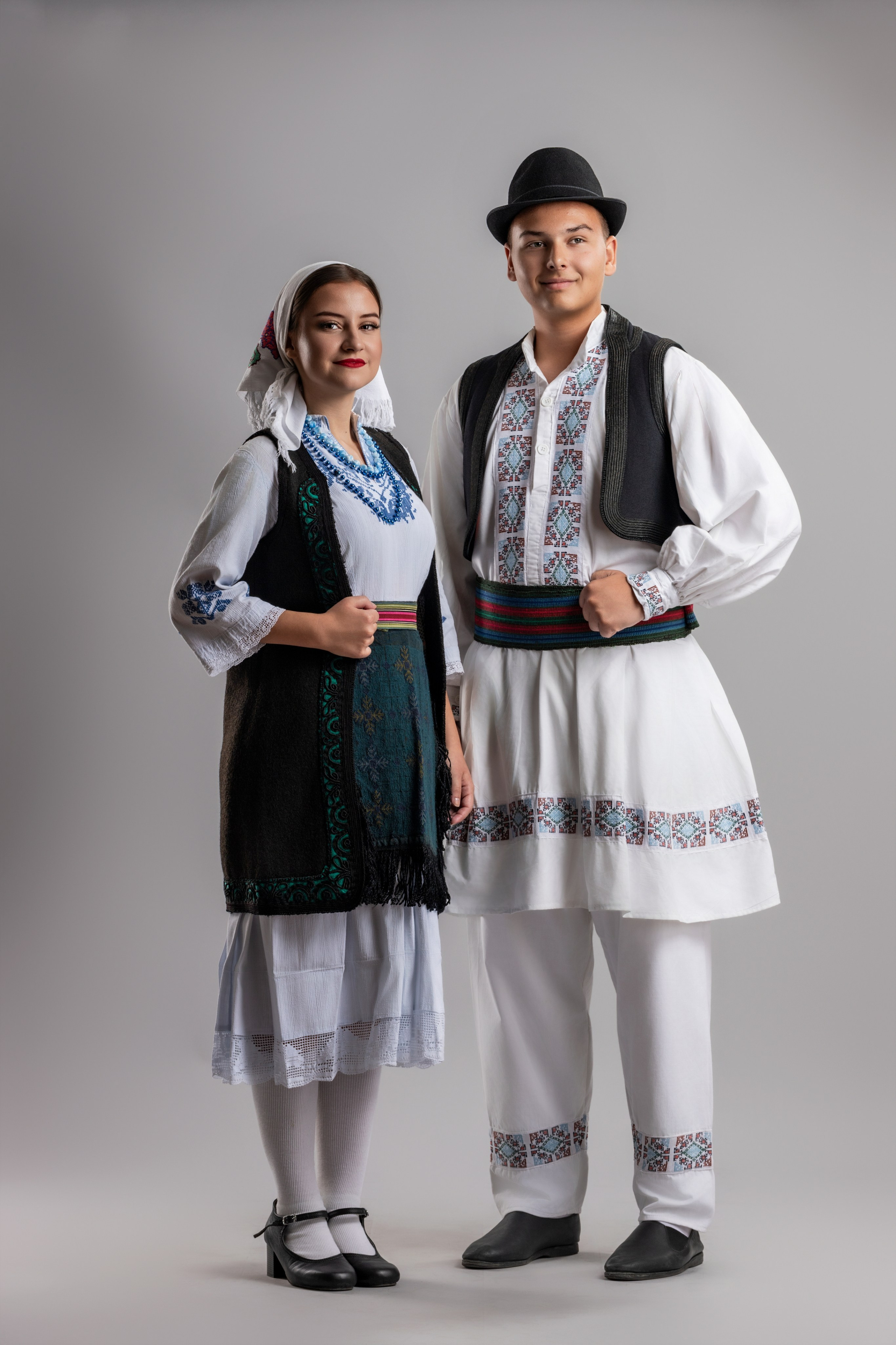 Studio portrait photography of traditional folk costumes from Bosnia and Herzegovina featuring authentic cultural clothing, embroidery, jewelry and handcrafted garments, photographed by Namir Čomaga. The images highlight the richness, craftsmanship and cultural heritage of Bosnian traditional costumes through carefully lit studio portraits.