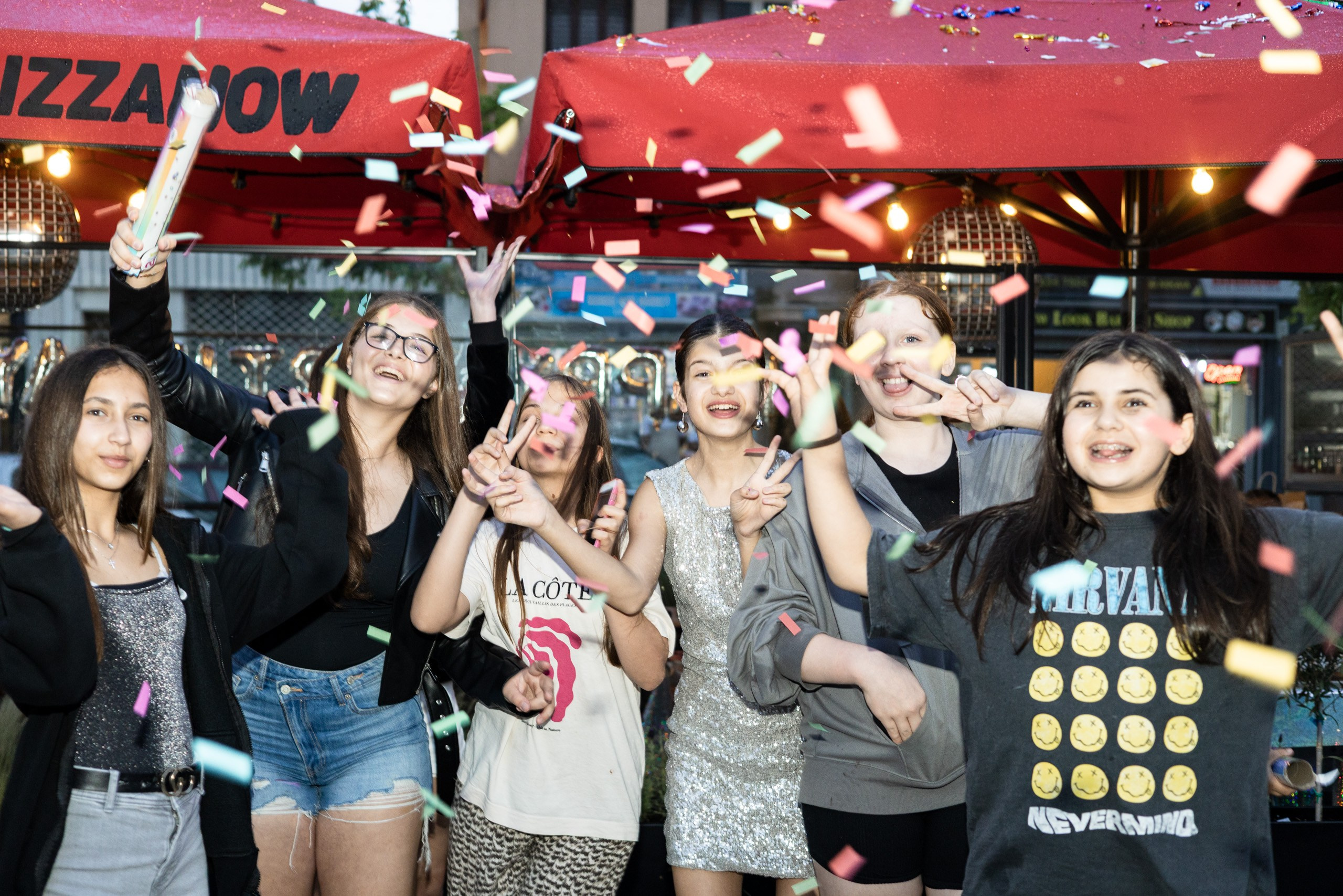 Friends celebrating together at a teenage birthday party