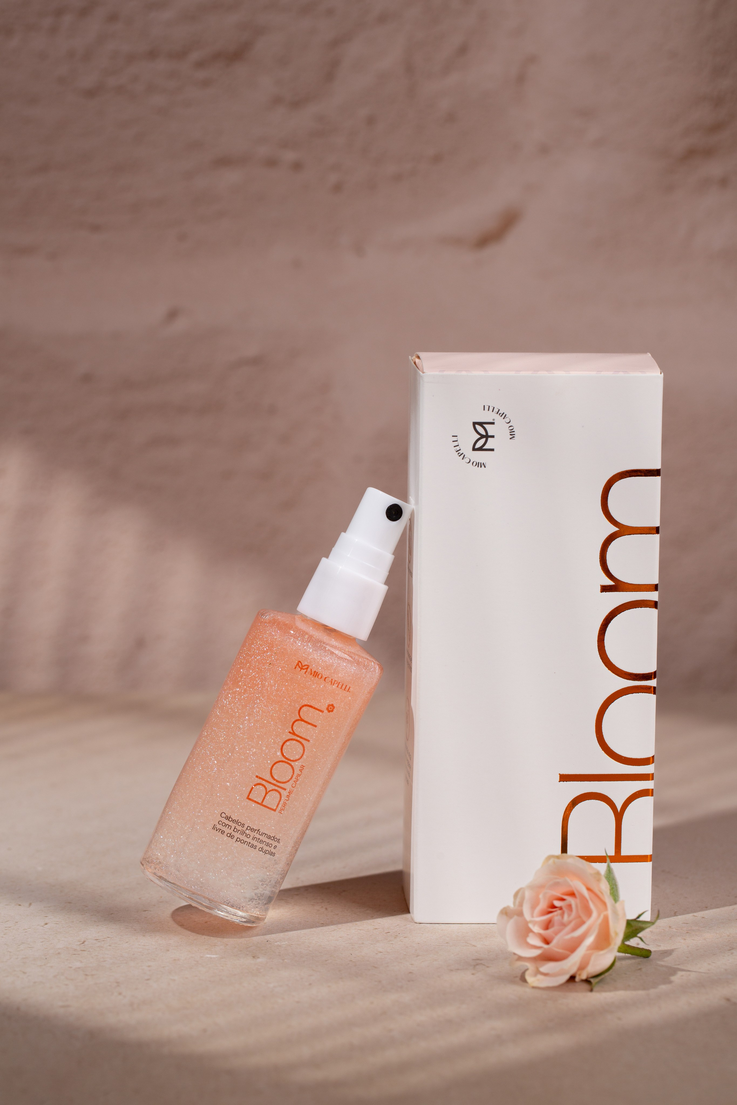 Hair serum bottle on a marble surface. 