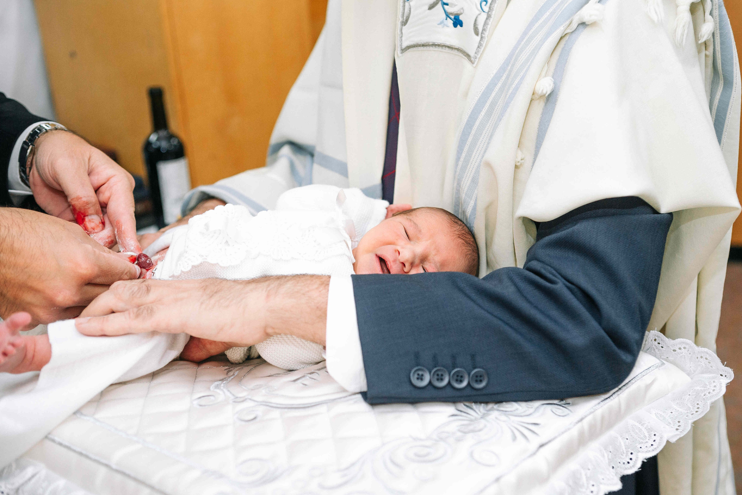 BRITH MILA IN THE SMALL SYNAGOGUE. PHOTOGRAPHER IN ISRAEL