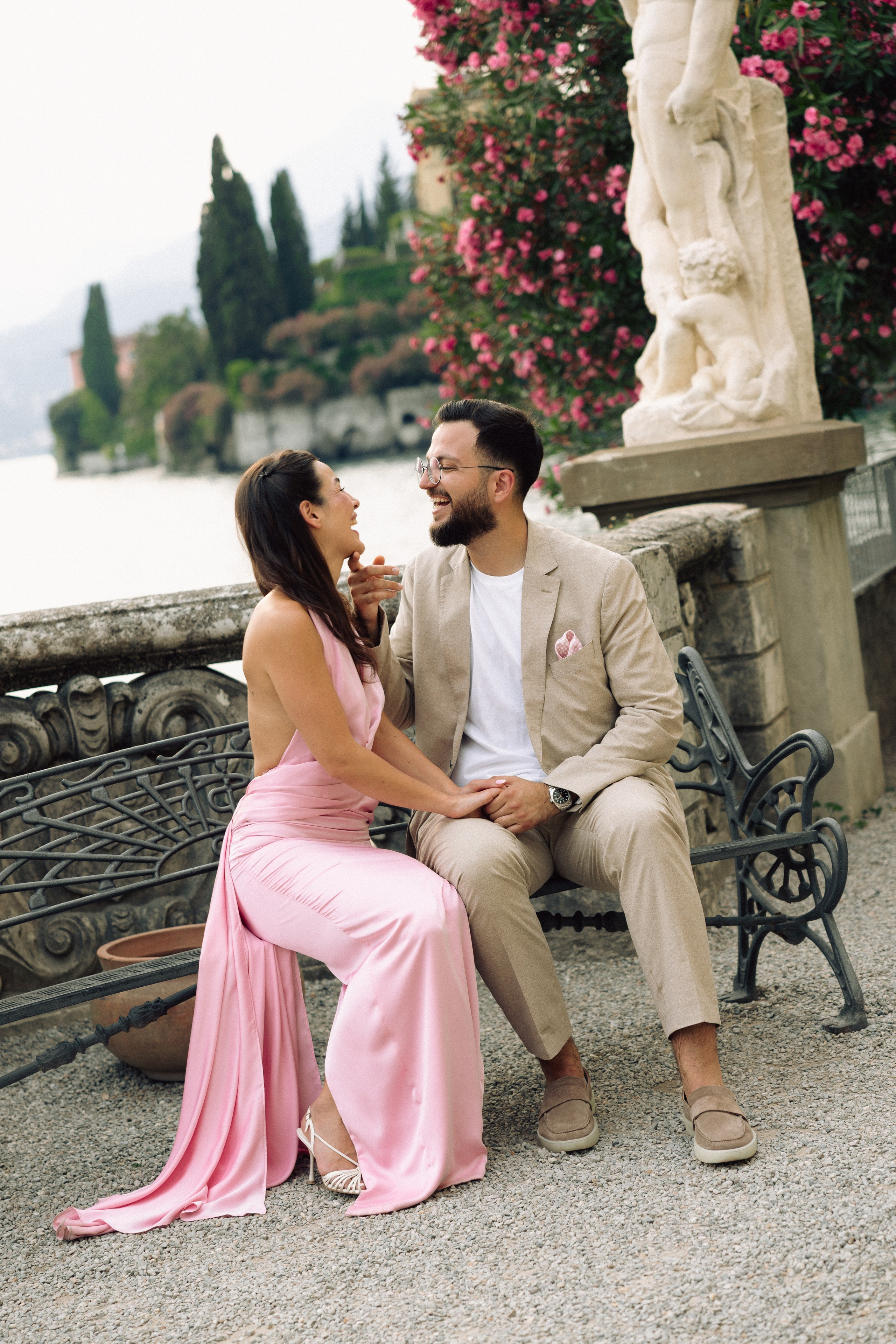 Romantic portrait of a couple after a surprise marriage proposal on Lake Como near Villa Monastero