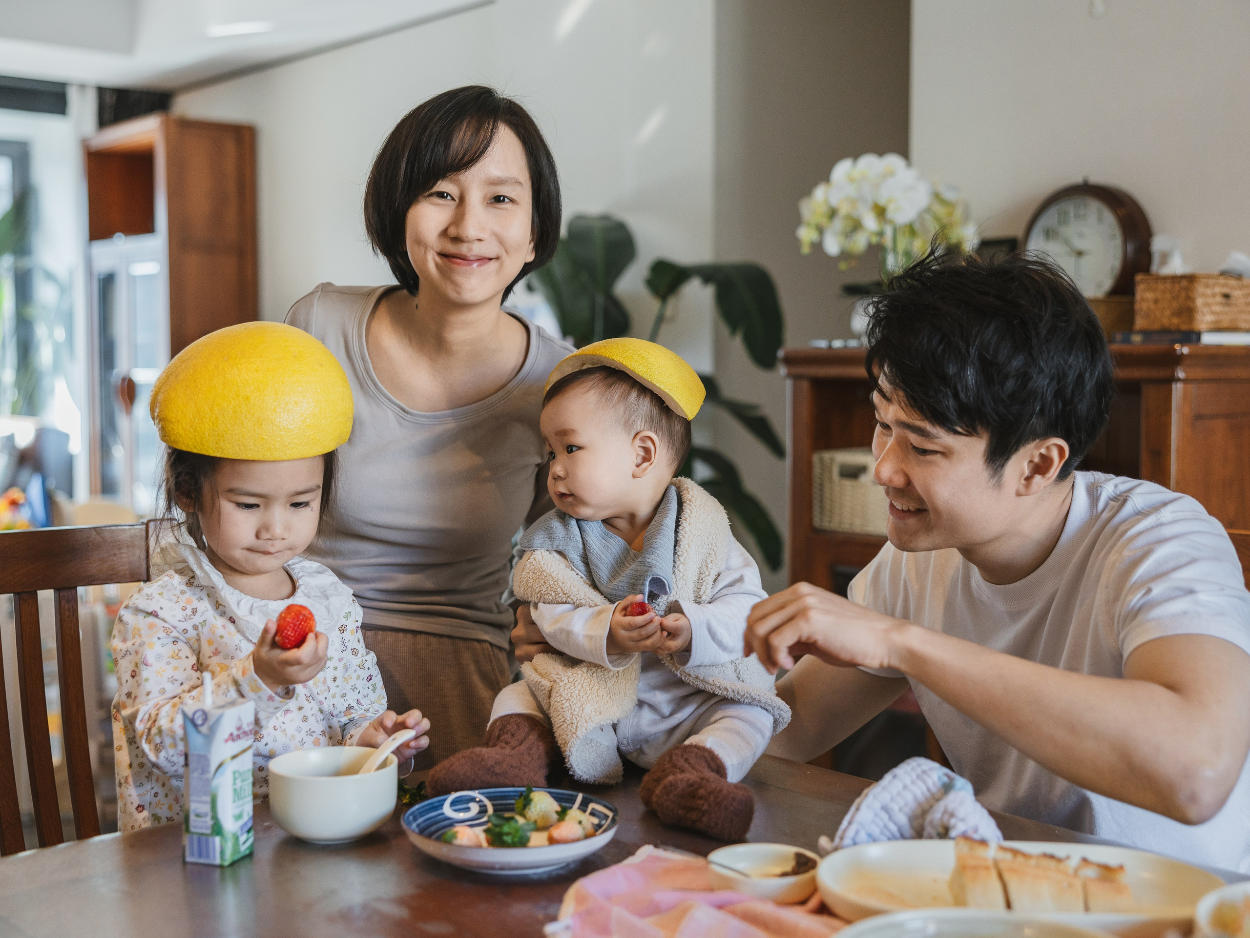 At my client's home in Shanghai, I captured a family of four having a meal. Both little girls were wearing pomelo peels on their heads.