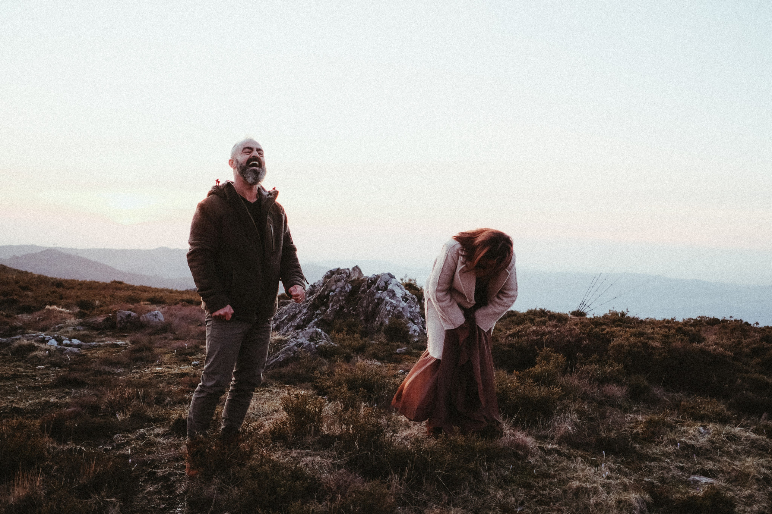 Couple walking through forest during engagement session in Portugal