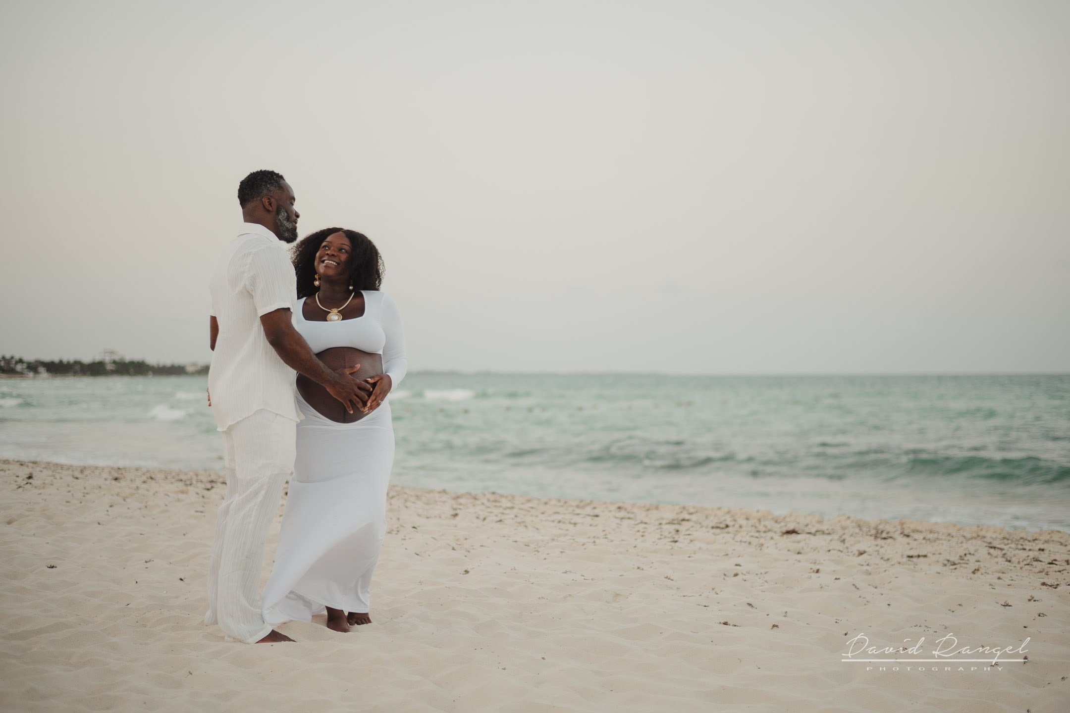 Maternity session of Ketsia & Ricketson at the beautiful colonial-style Valentin Imperial Maya Hotel. Destination wedding photographer based in Cancun and Riviera Maya with service worldwide