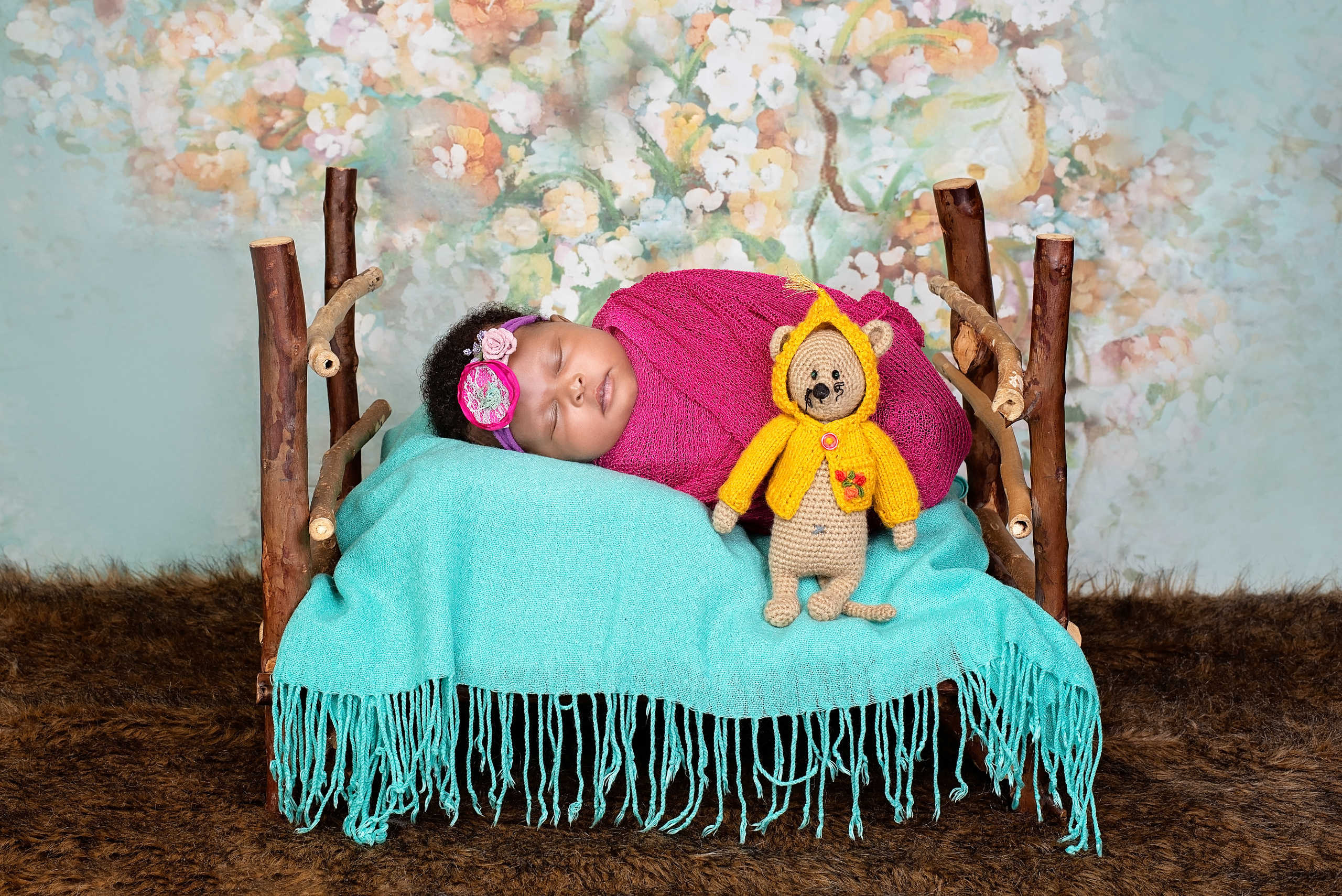 Black Kenyan baby girl photo shoot in the wooden bed Kisumu Eldoret 