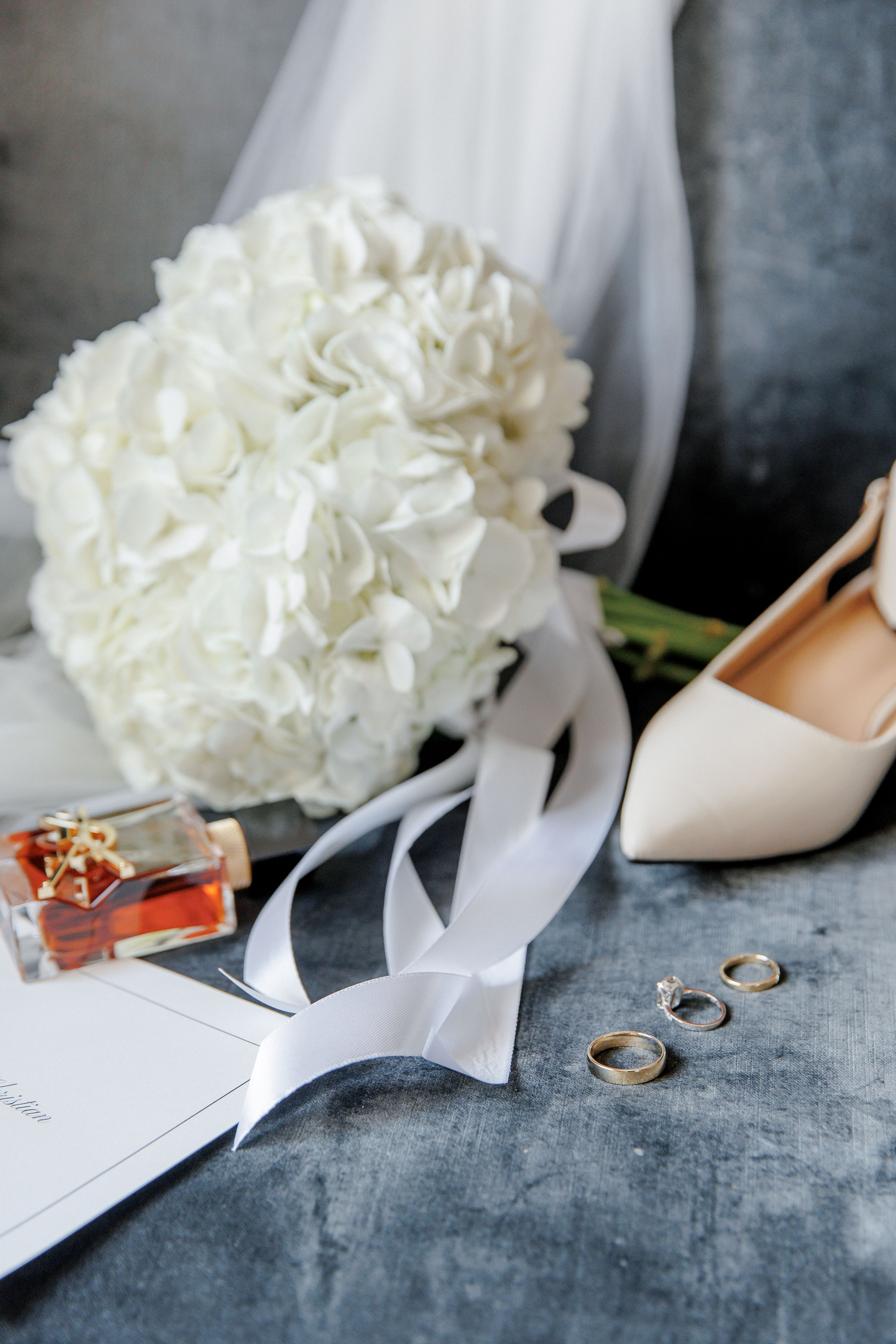 Elegant bridal accessories, including wedding shoes, veil and jewelry, styled for a destination wedding in Barcelona.