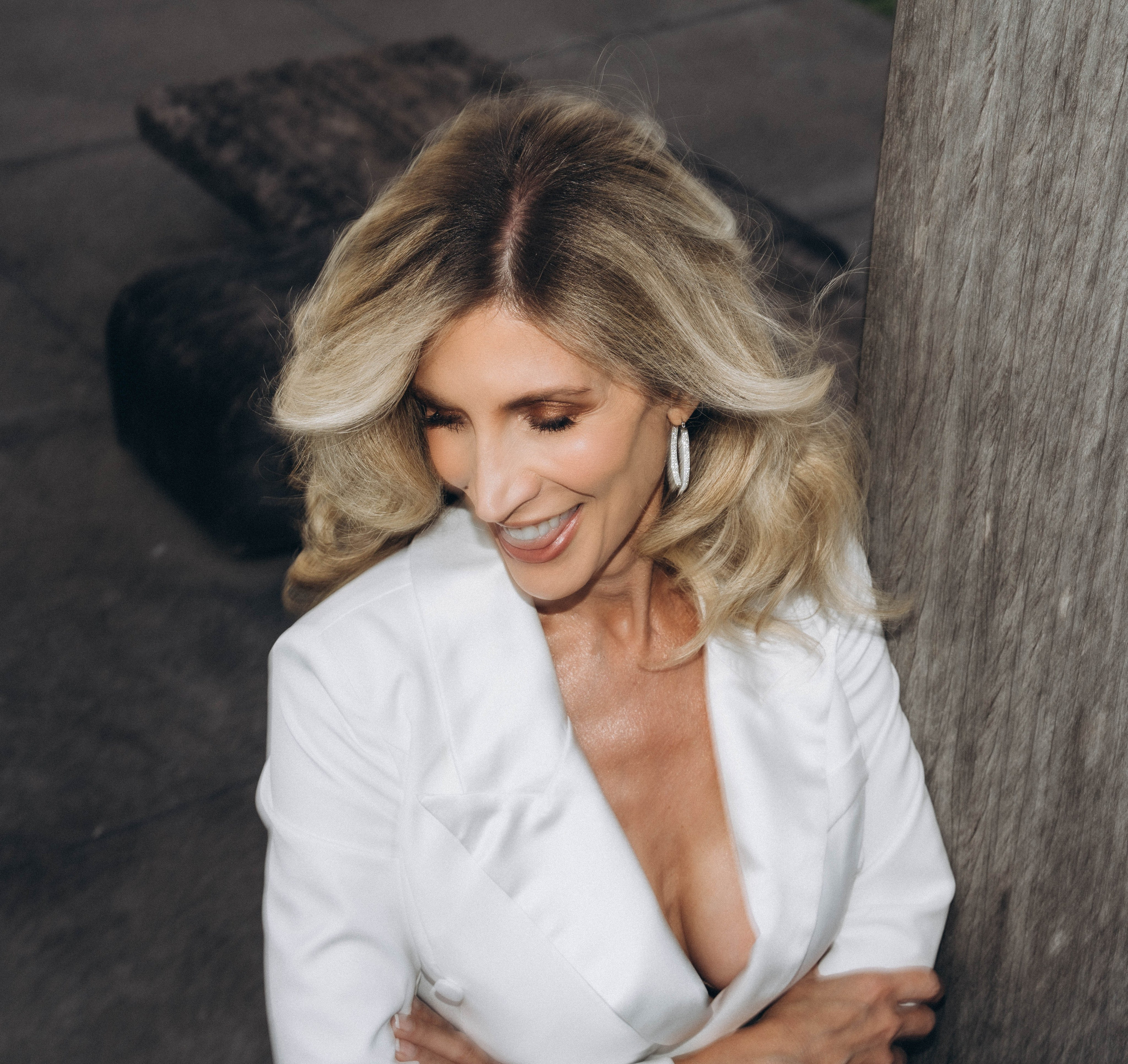 Elegant bride on dock overlooking Sacandaga Lake.