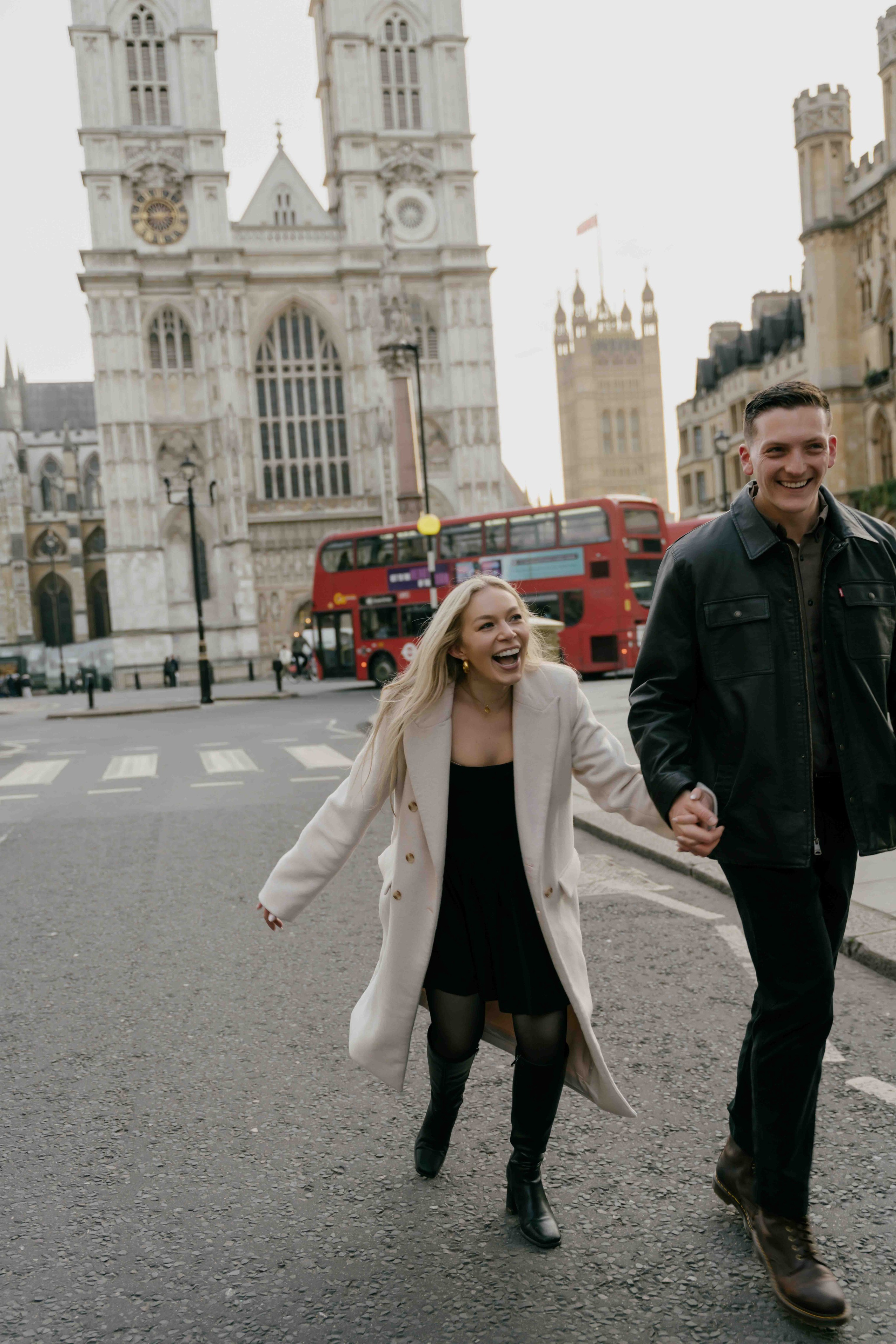 Couple walking in Westminster after proposal, sunrise London engagement session