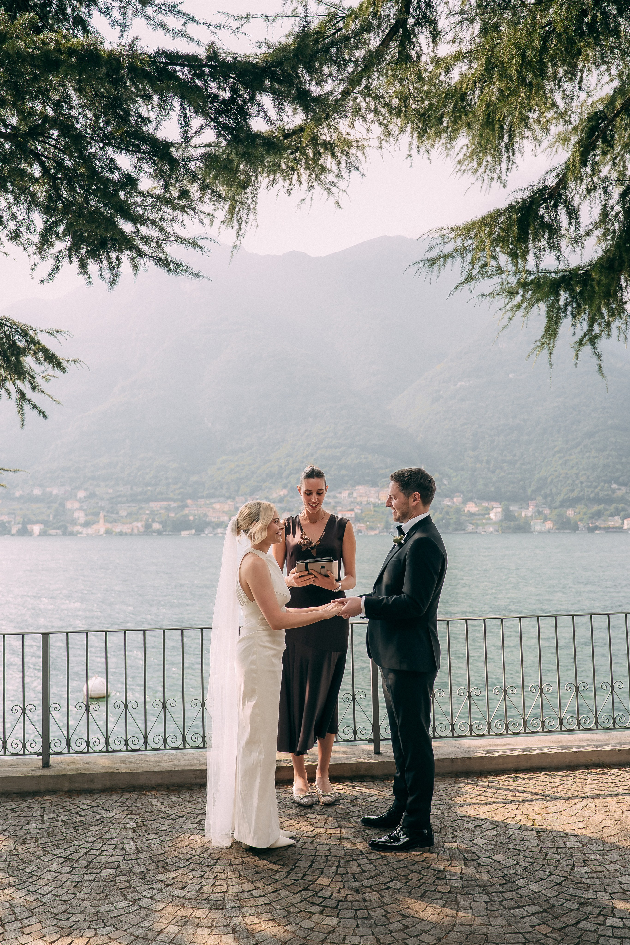 Bride and groom portrait on the lakeside terrace at Villa Lario, Italy