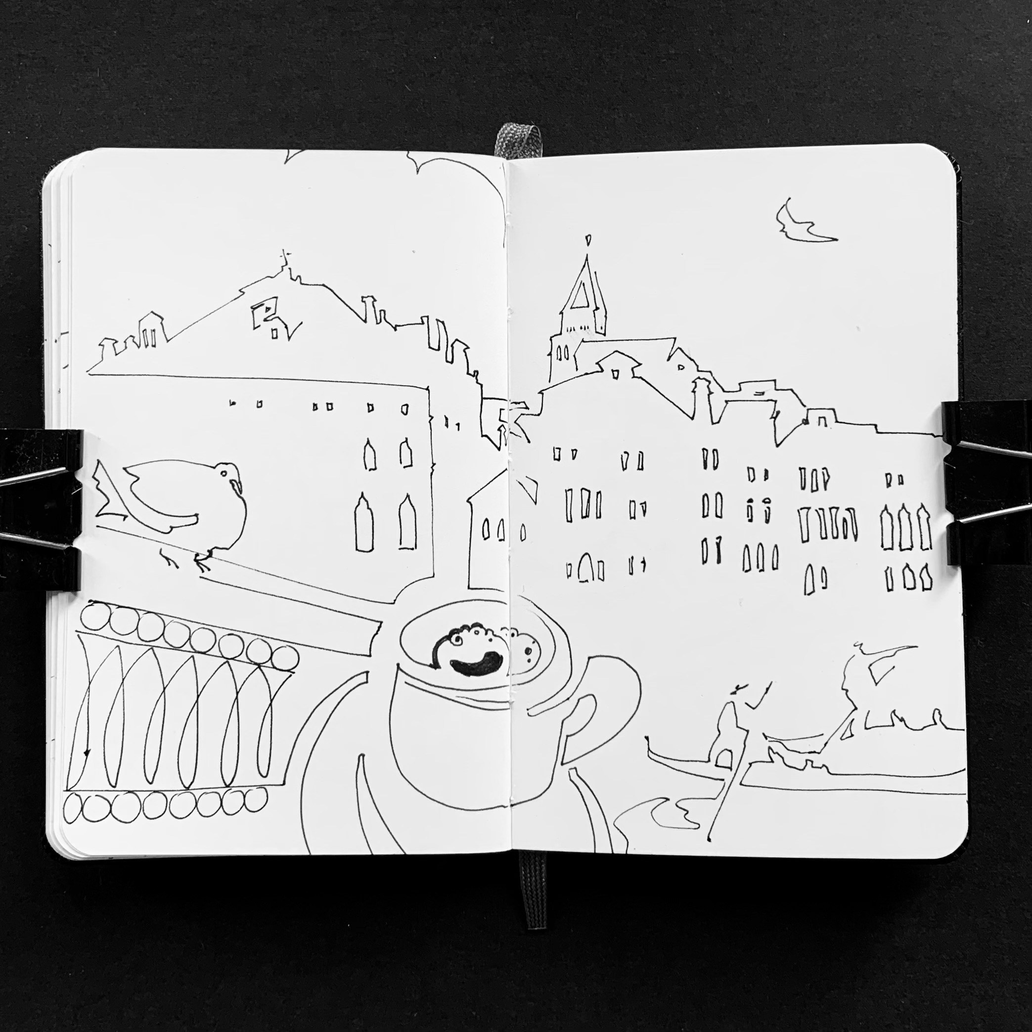 Moleskine notebook with original drawings made in Venice, works on paper developed as part of an artist’s editorial project. A drawing of a coffee cup and a pigeon against Venetian roofs.