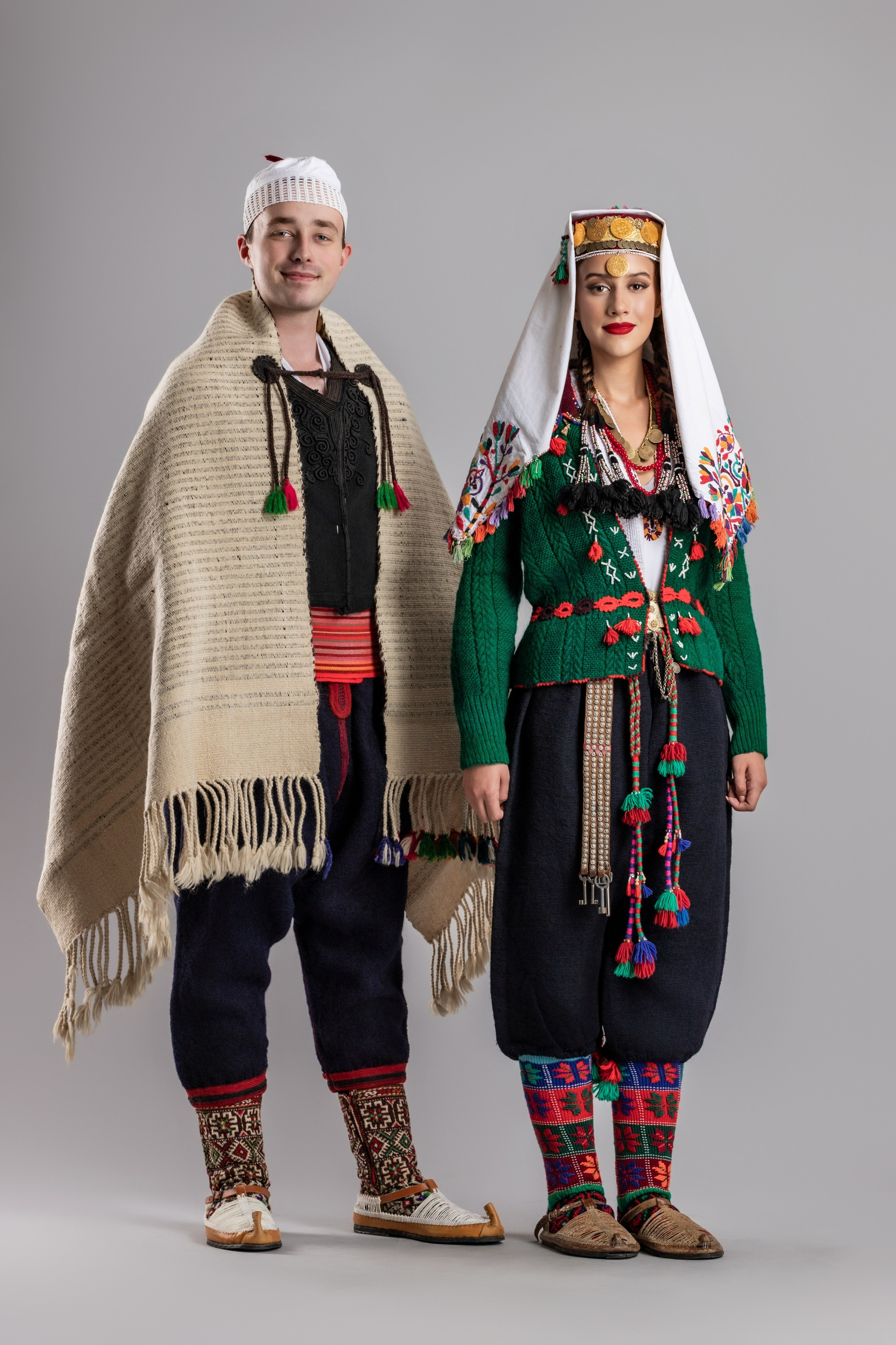 Studio portrait photography of traditional folk costumes from Bosnia and Herzegovina featuring authentic cultural clothing, embroidery, jewelry and handcrafted garments, photographed by Namir Čomaga. The images highlight the richness, craftsmanship and cultural heritage of Bosnian traditional costumes through carefully lit studio portraits.