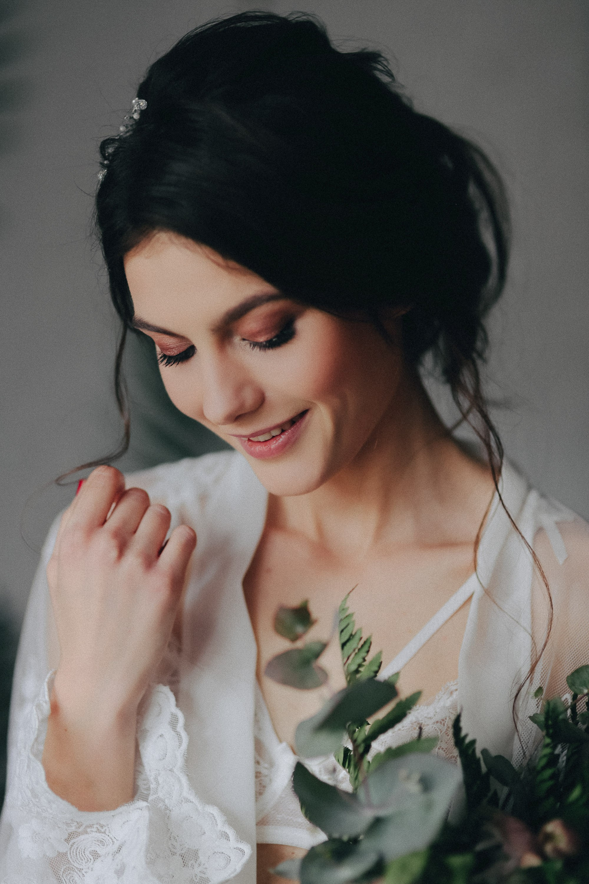 Bride smiling while looking down, soft natural light