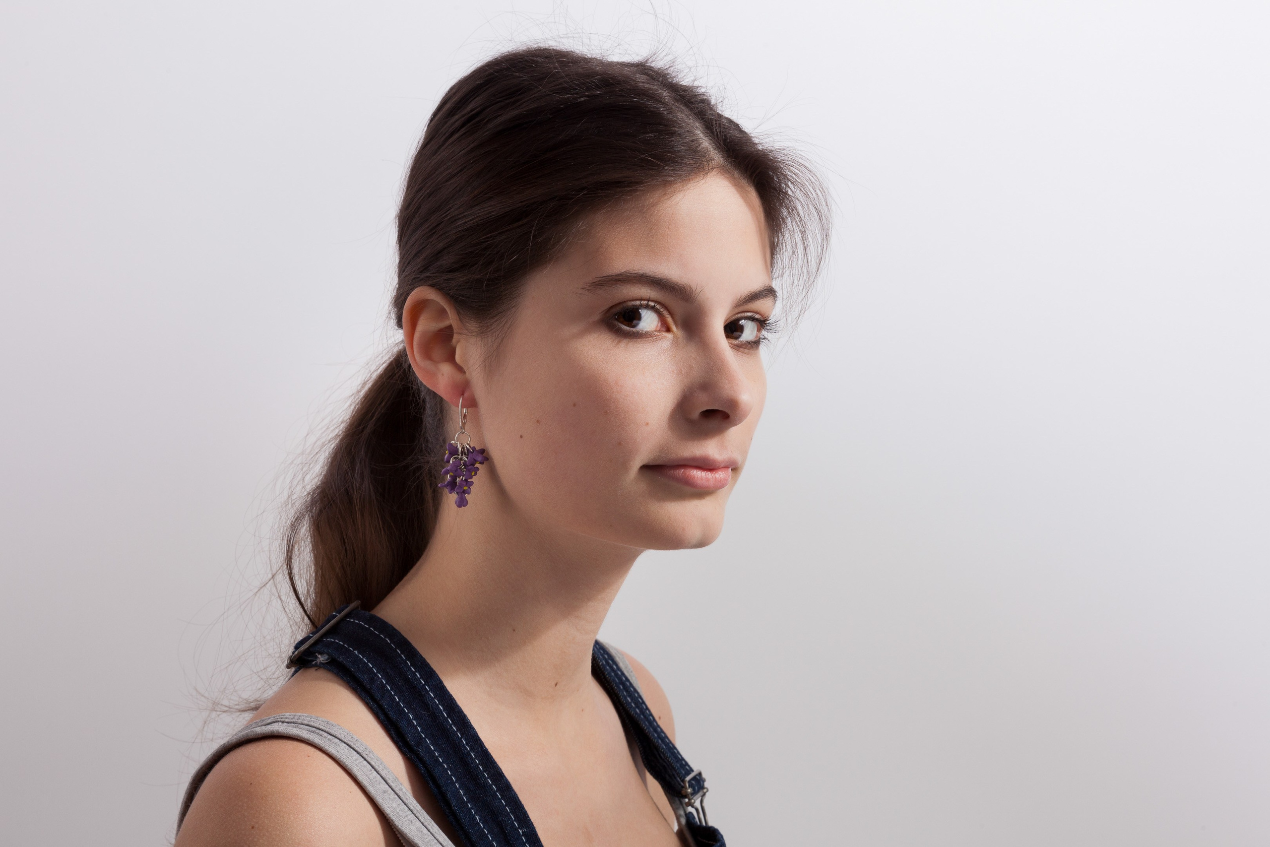 Portrait of a young girl on white studio background - photographer Andrey Dunin