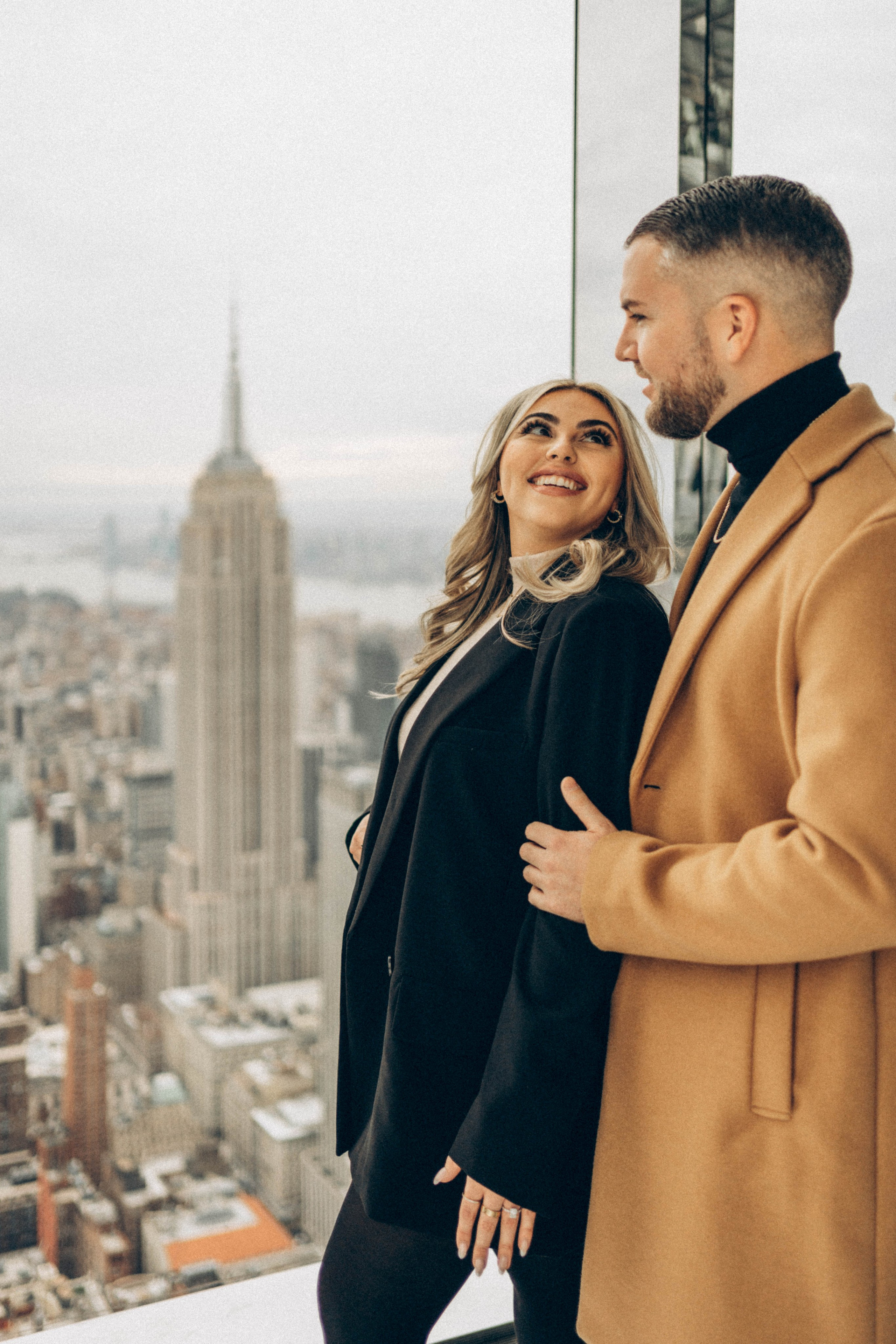 Proposal in Central Park fall leaves backdrop.