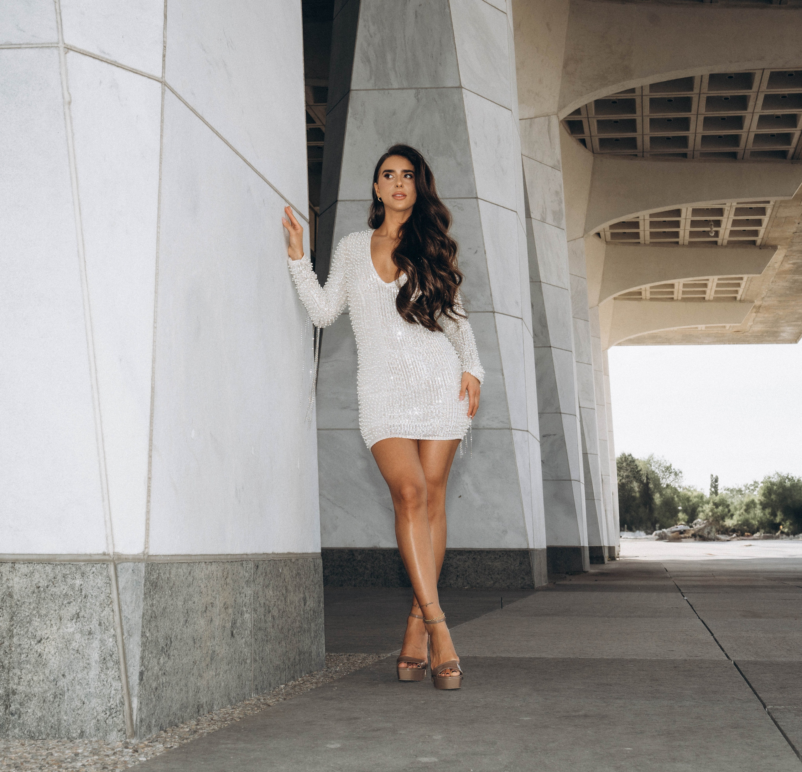Bride holding bouquet near Syracuse cathedral.