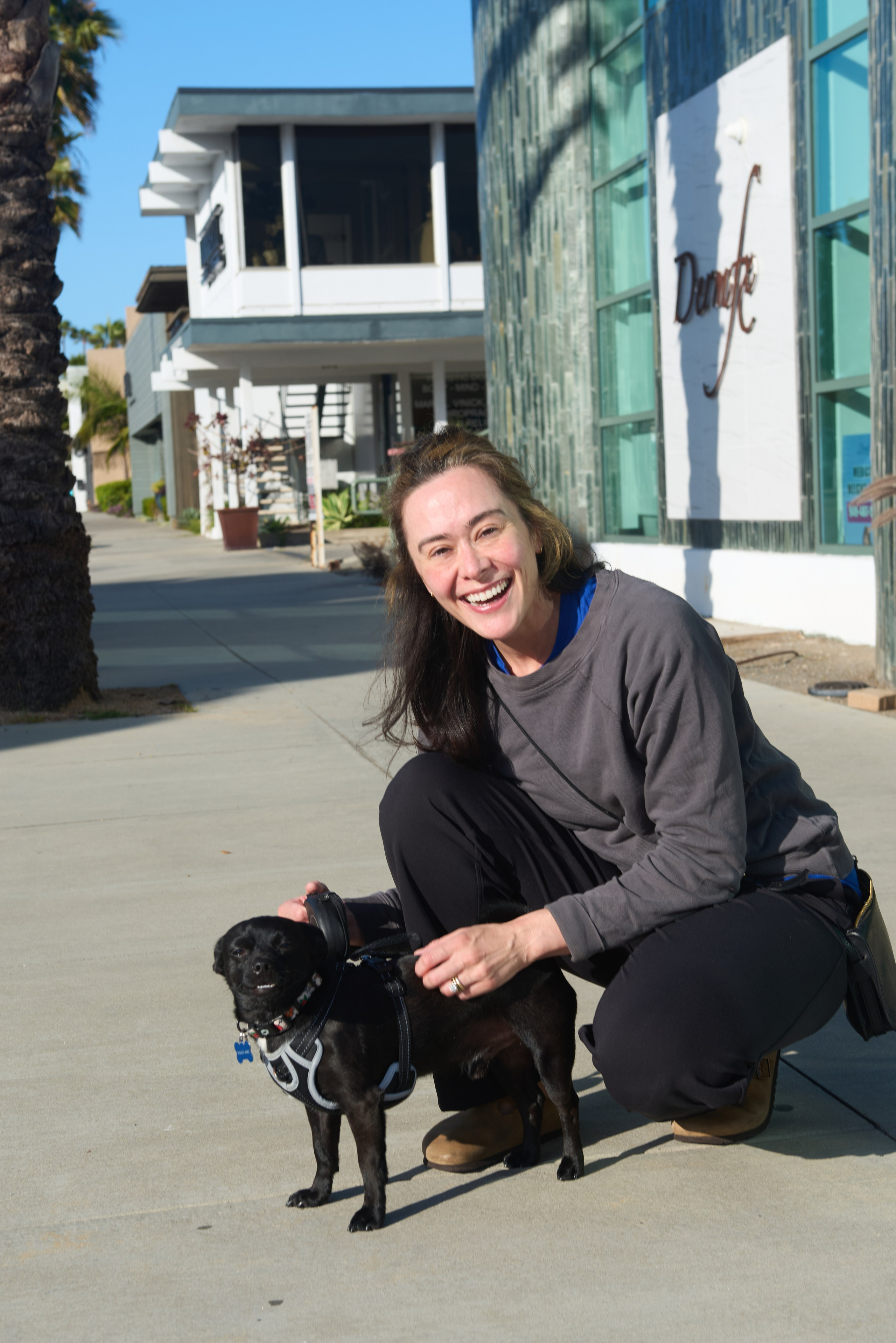 Dog resting beside its owner during an intimate lifestyle photoshoot in Los Angeles