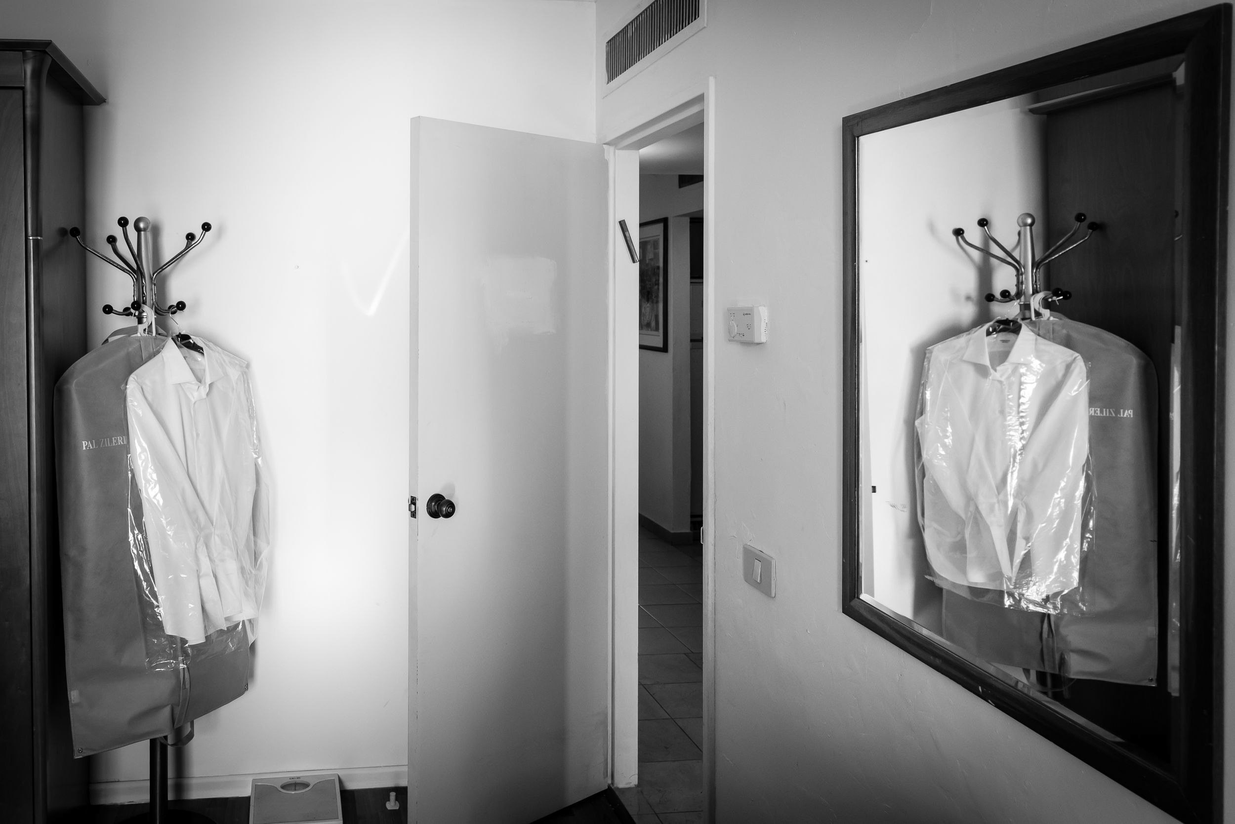 Groom Michael's wedding attire hanging before the ceremony at the Leonardo Hotel in Haifa, Israel