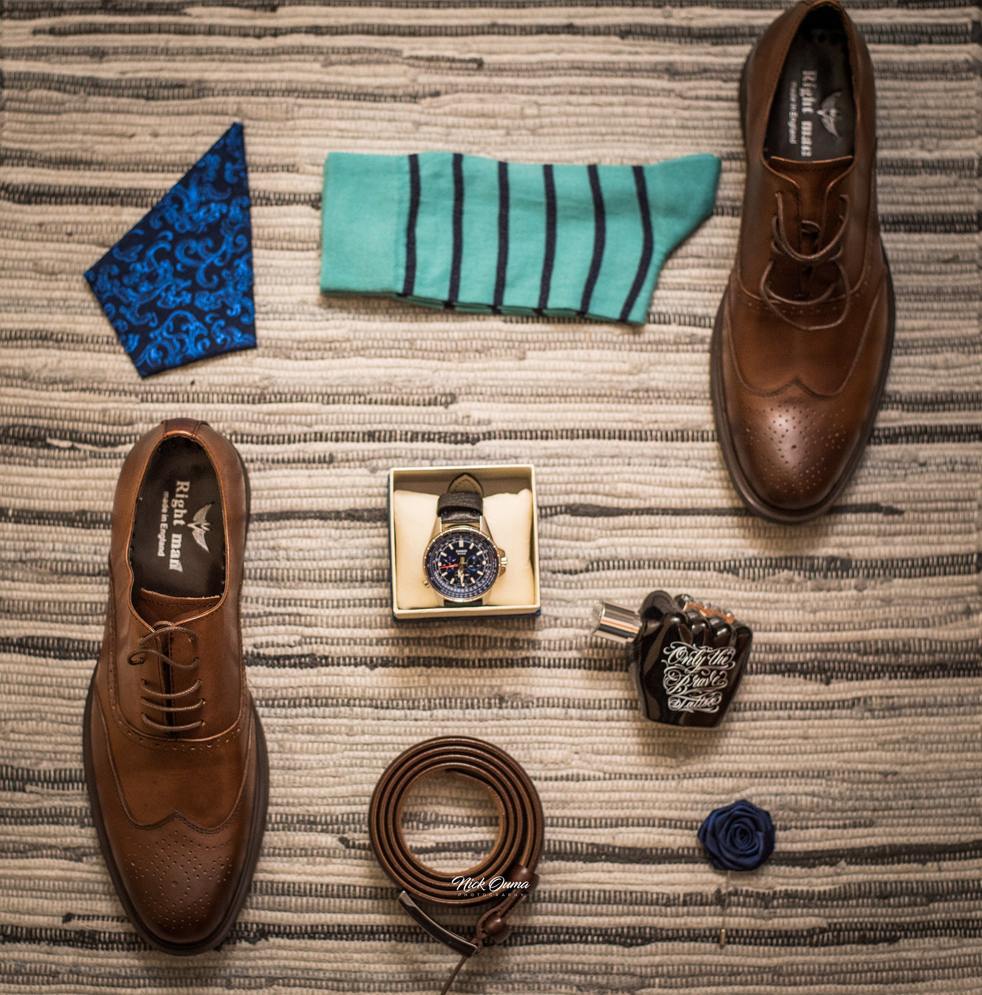 Detail wedding shots of the groomsman's shoes and accessories