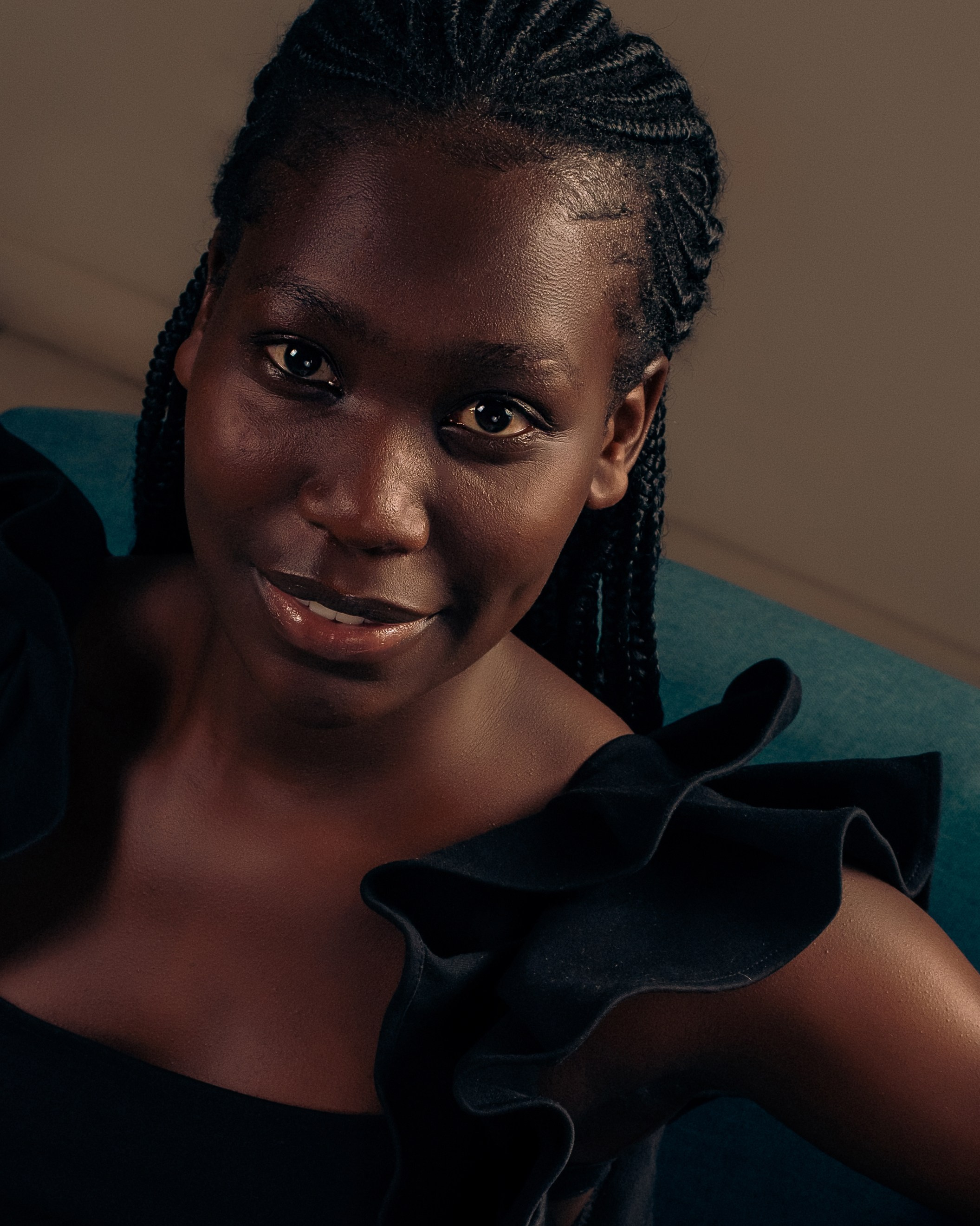 Artistic composition of a studio portrait of a woman in a black dress
