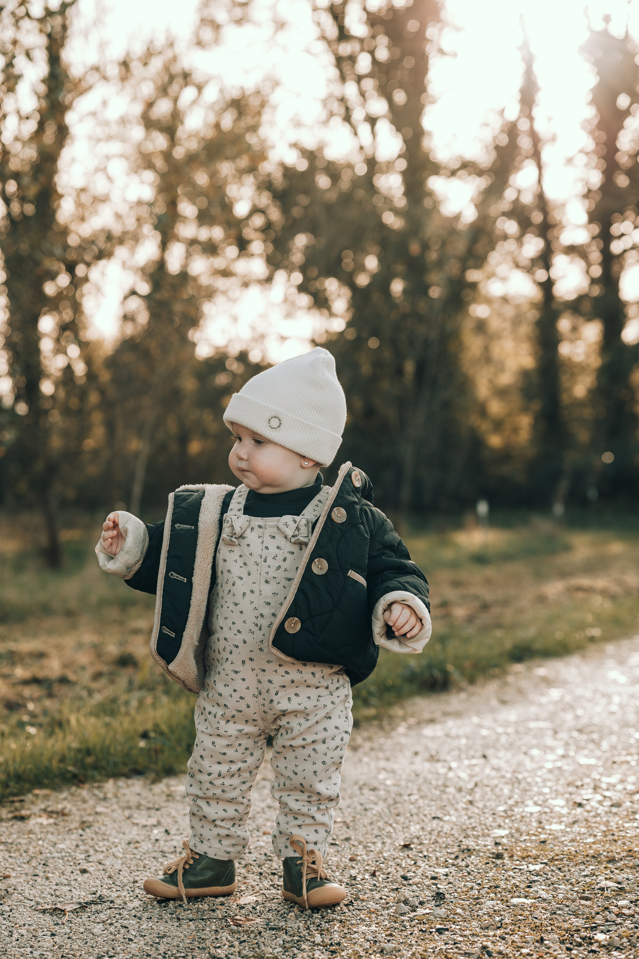 Little girl with a hat on an autumn walk