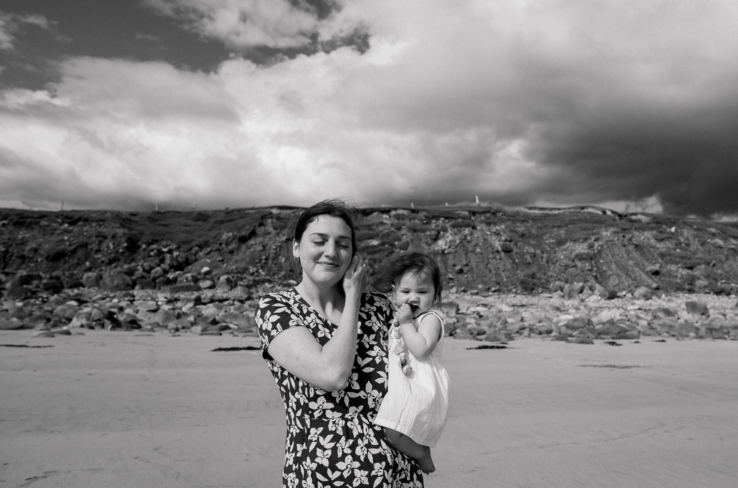 Darya and Mia at the ocean. Wedding and family photographer Ireland