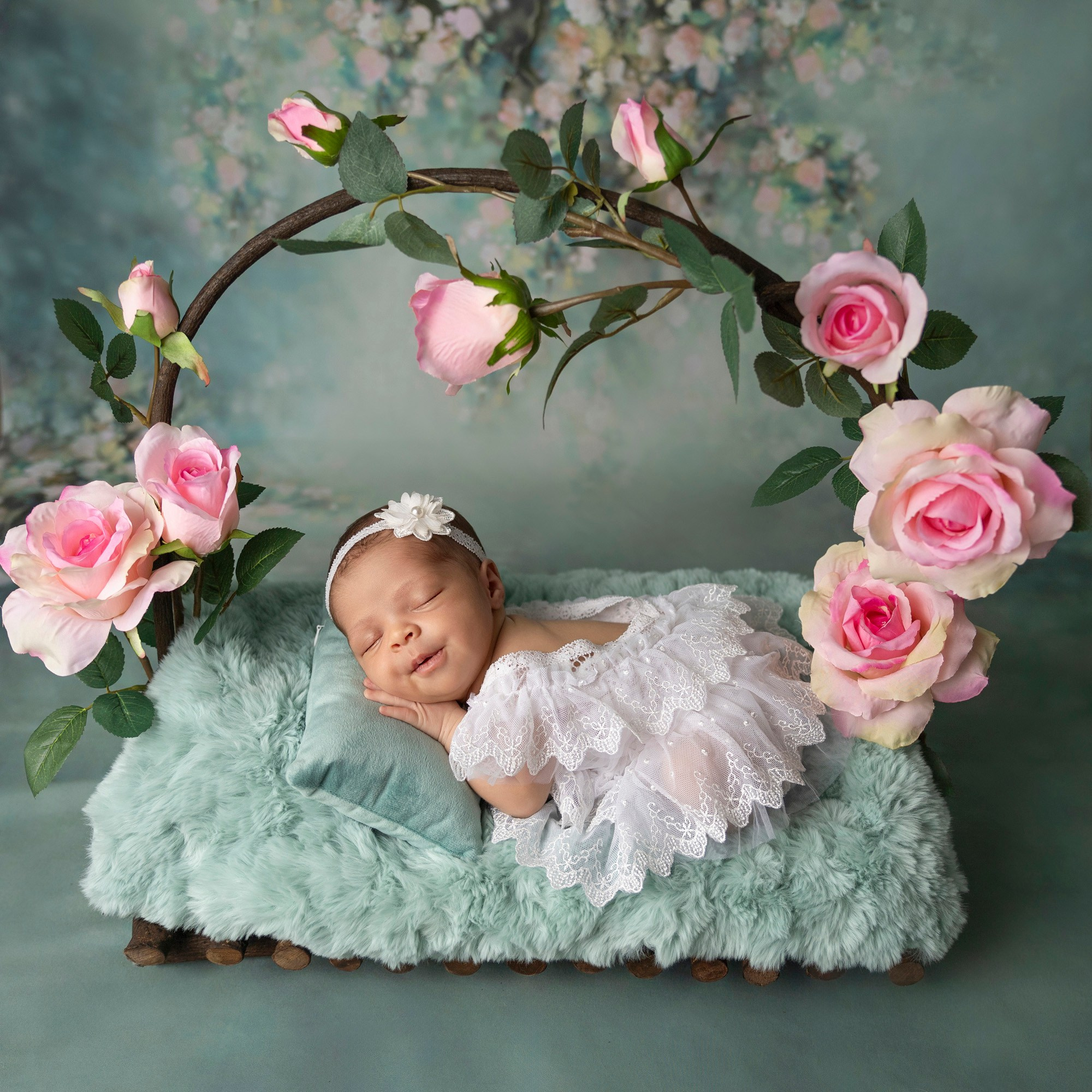 newborn and flower arch prop