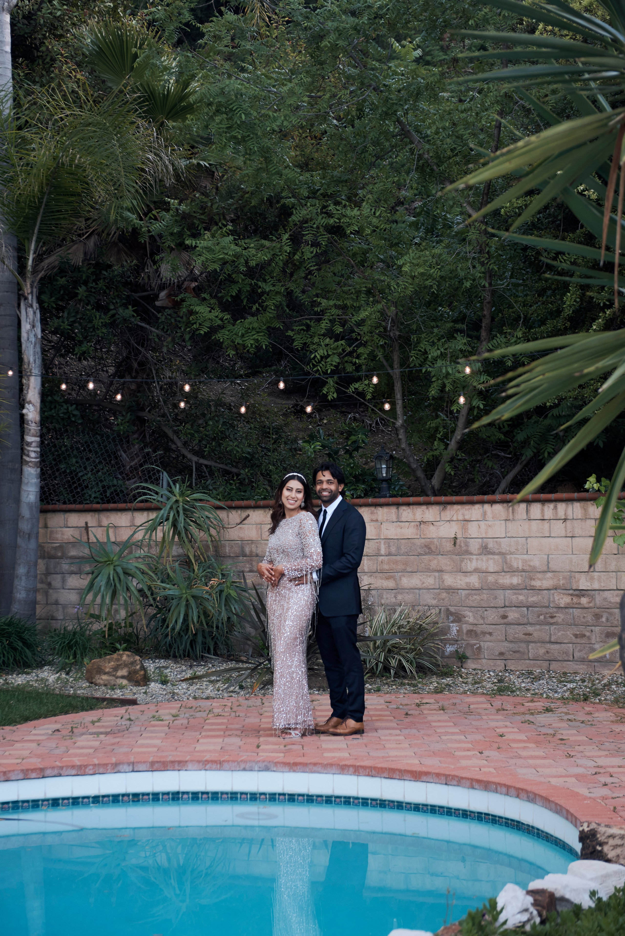 Romantic engagement photo of a couple embracing at sunset in Los Angeles