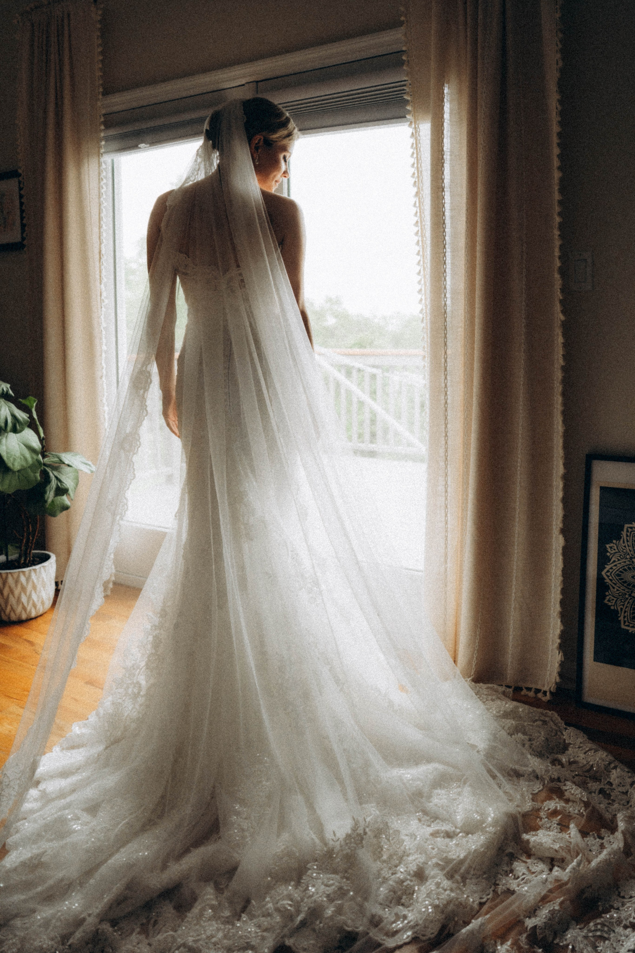 Bride twirling dress near Lake Placid lodge.