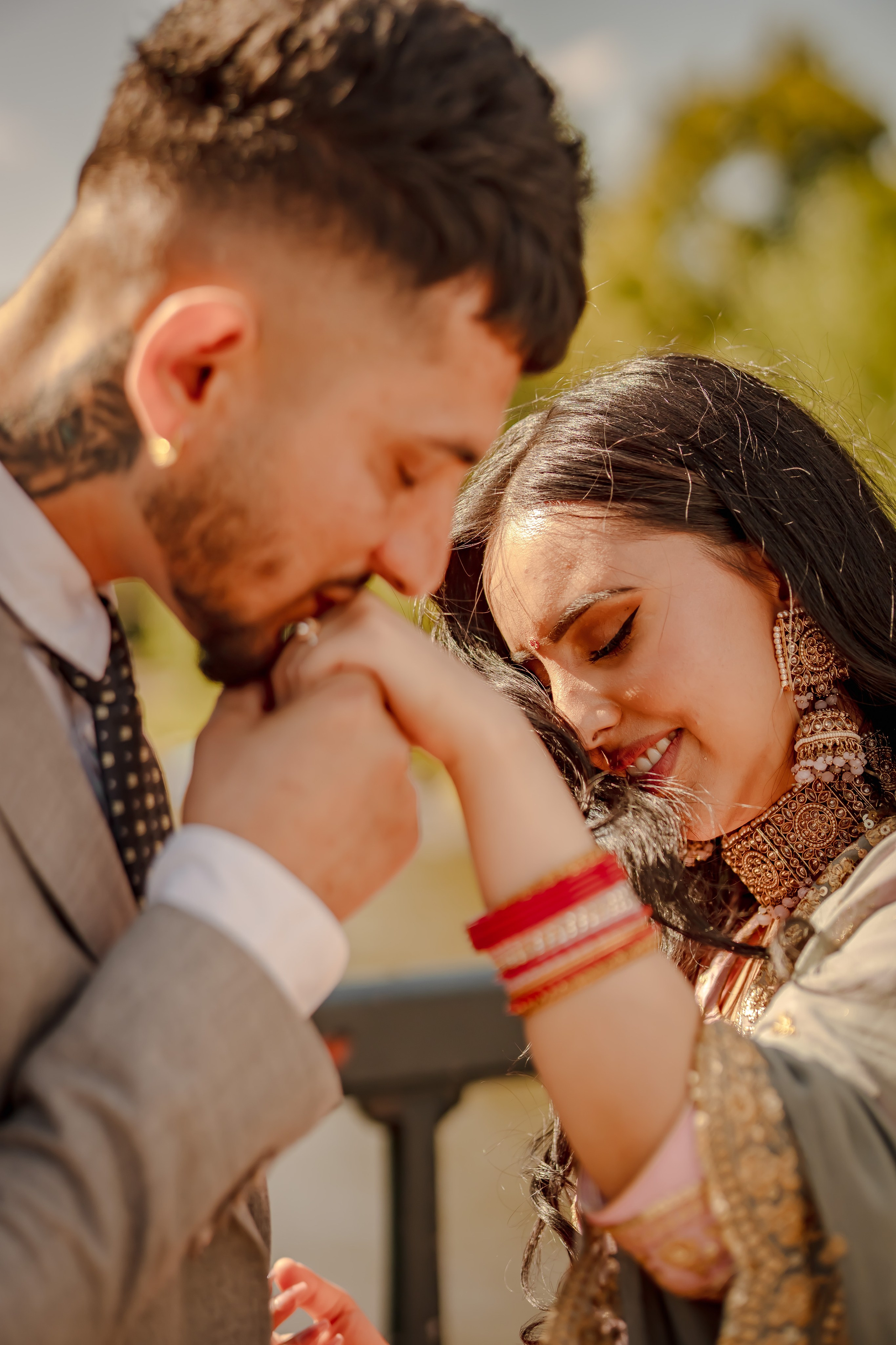 a man kissing the hand of his wife