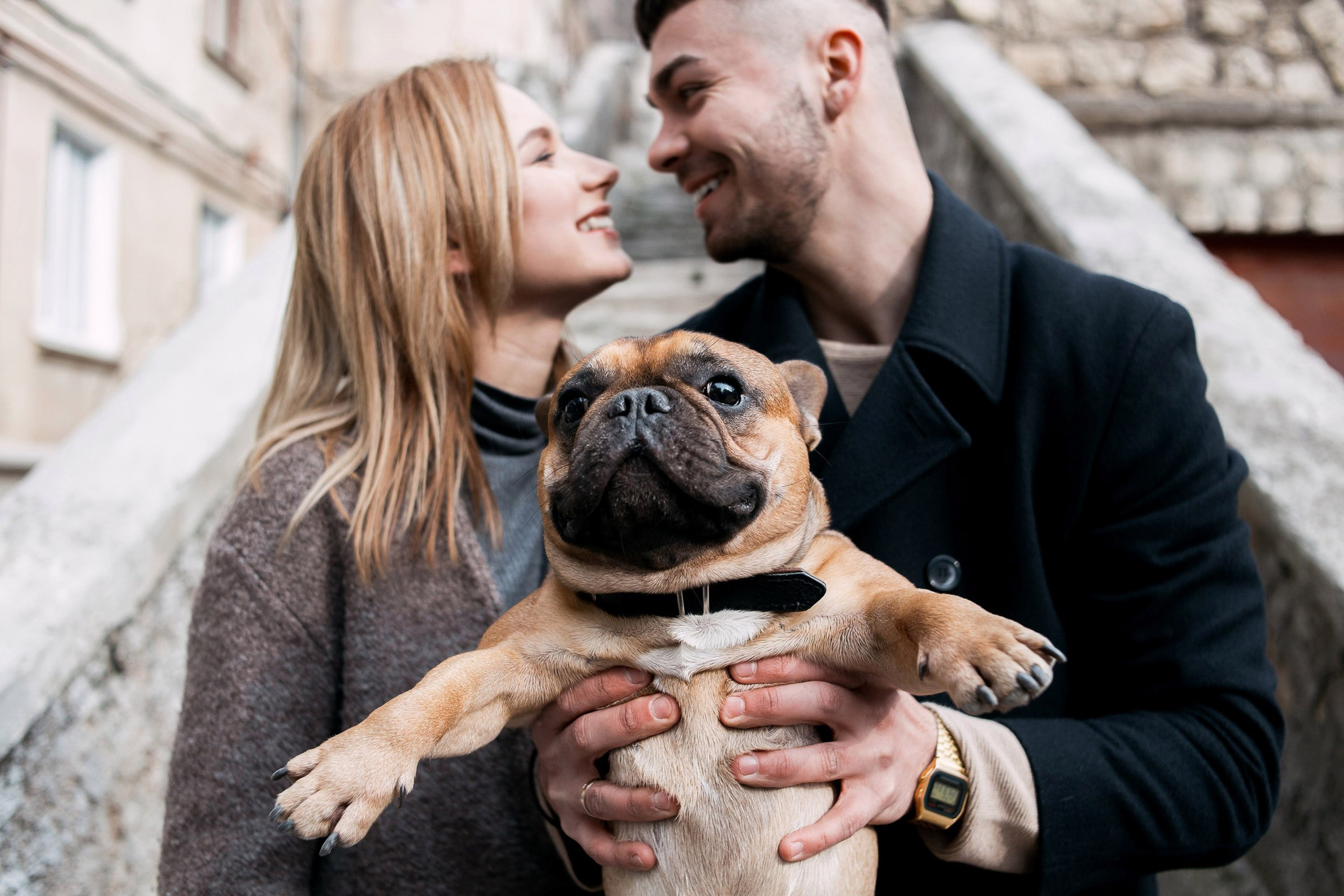 Couple toasting with coffee cups, engagement photoshoot